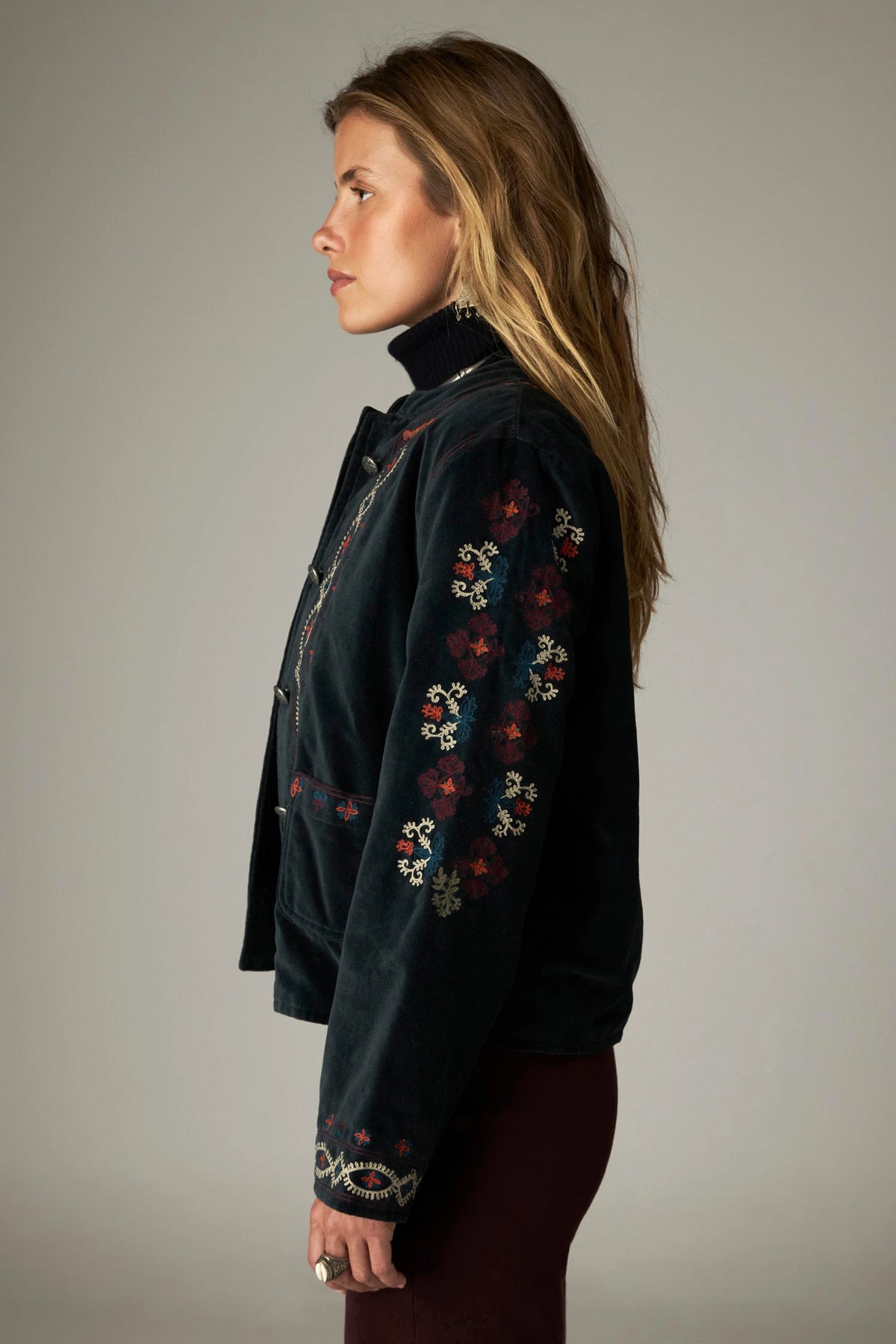 Shop the Maison Hotel Breton Jacket in Jade at Dotique. A cotton velvet jacket with colourful embroidered trims, button front and patch pockets.