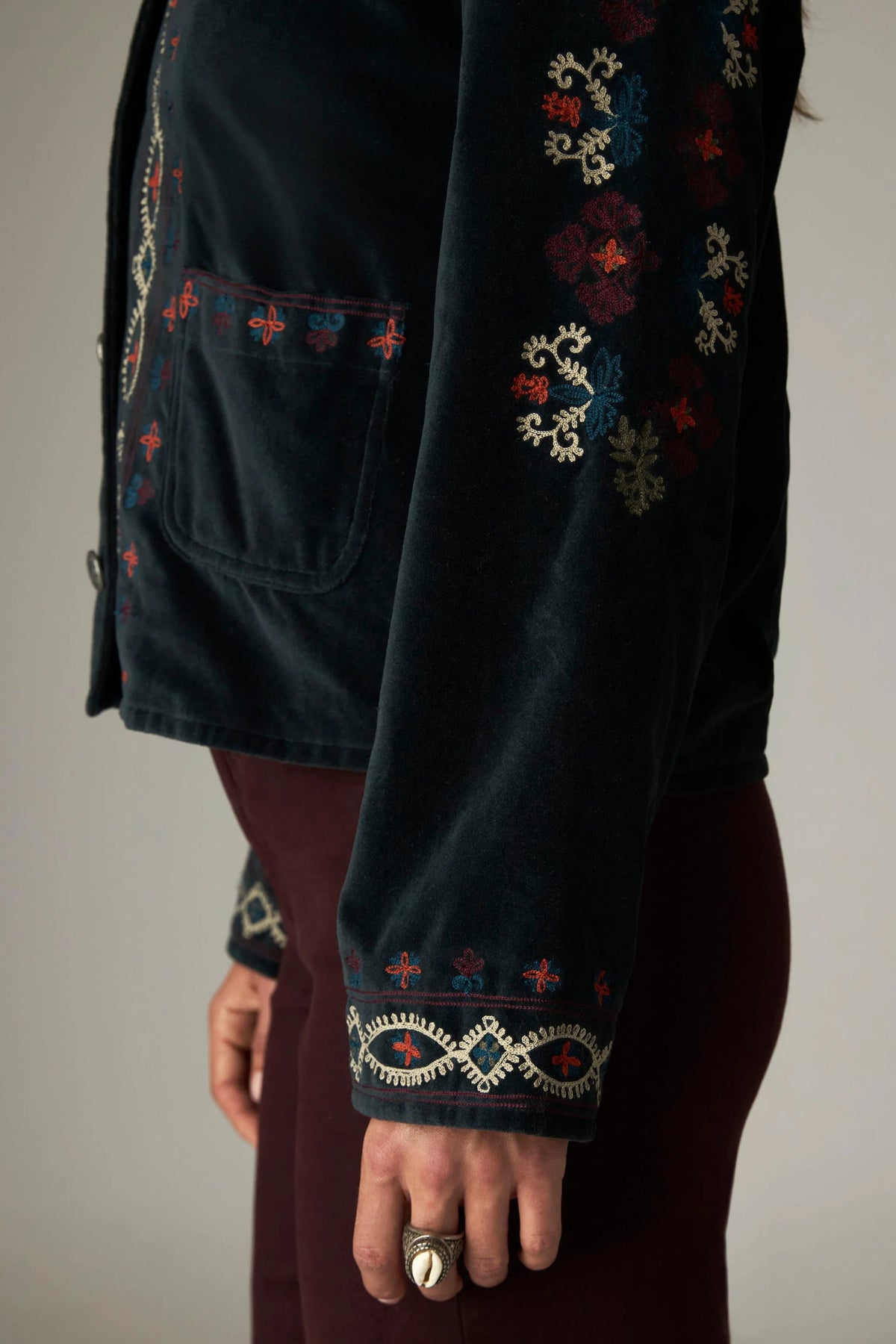 Shop the Maison Hotel Breton Jacket in Jade at Dotique. A cotton velvet jacket with colourful embroidered trims, button front and patch pockets.