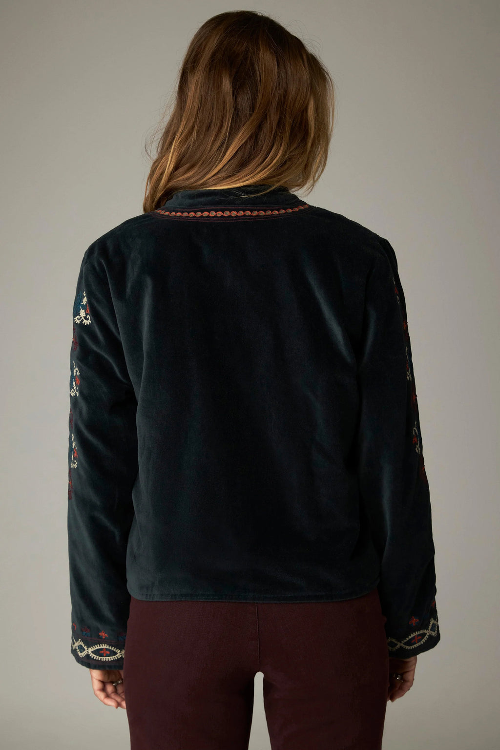 Shop the Maison Hotel Breton Jacket in Jade at Dotique. A cotton velvet jacket with colourful embroidered trims, button front and patch pockets.