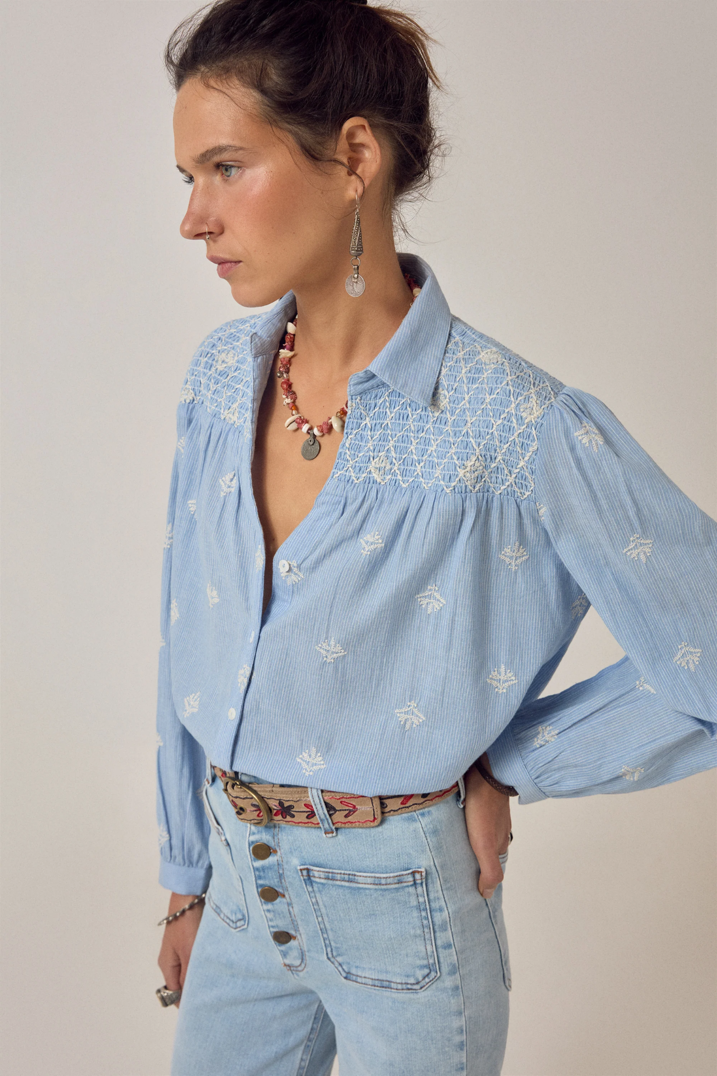 Young woman in embroidered Maison Hotel James Shirt Sky Blues Sunny by Maison Hotel, shop Maison Hotel at Dotique.