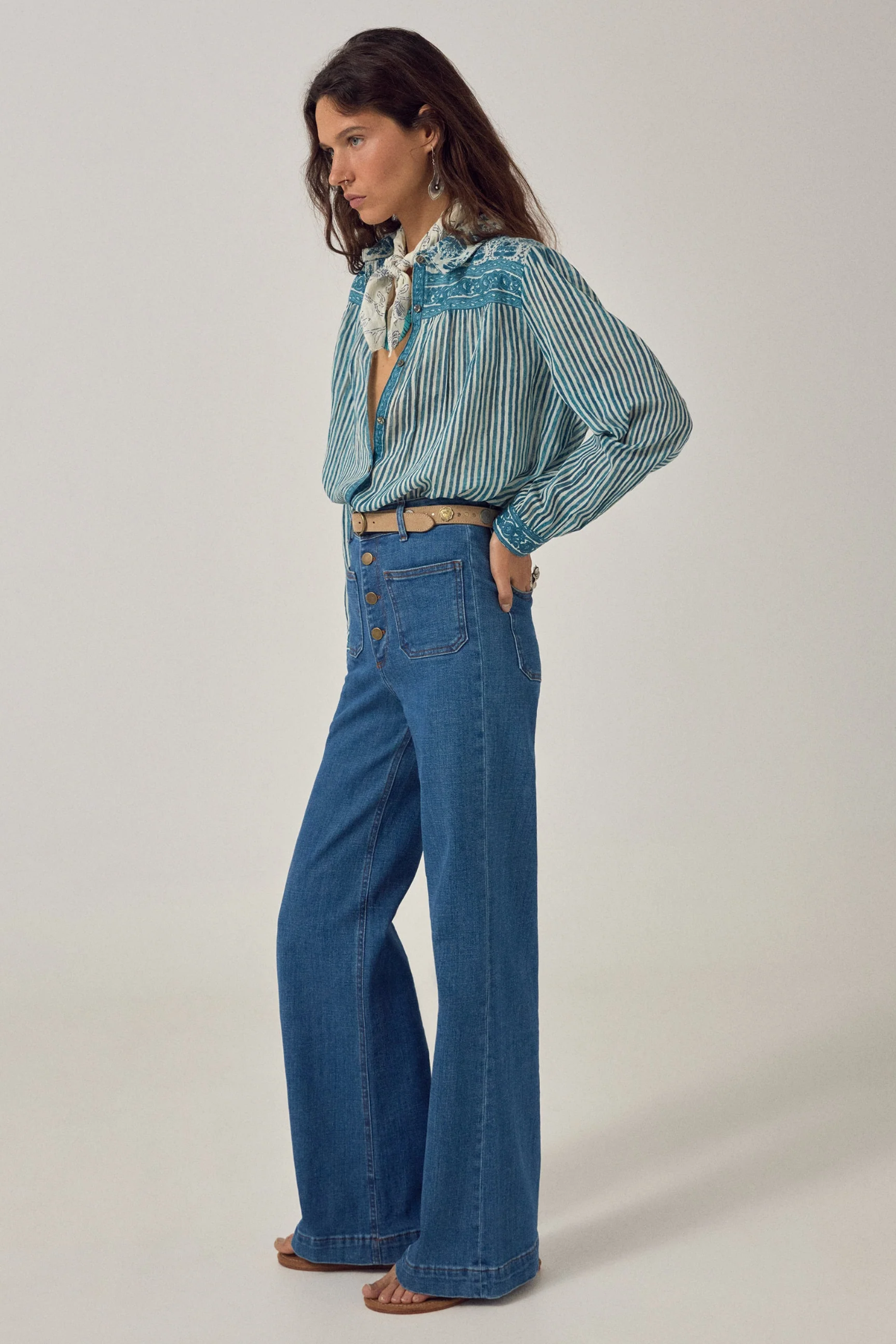 Woman wearing Maison Hotel Maria Shirt - Mediterranean Stripes Blue Ink paired with jeans, shop Maison Hotel at Dotique.