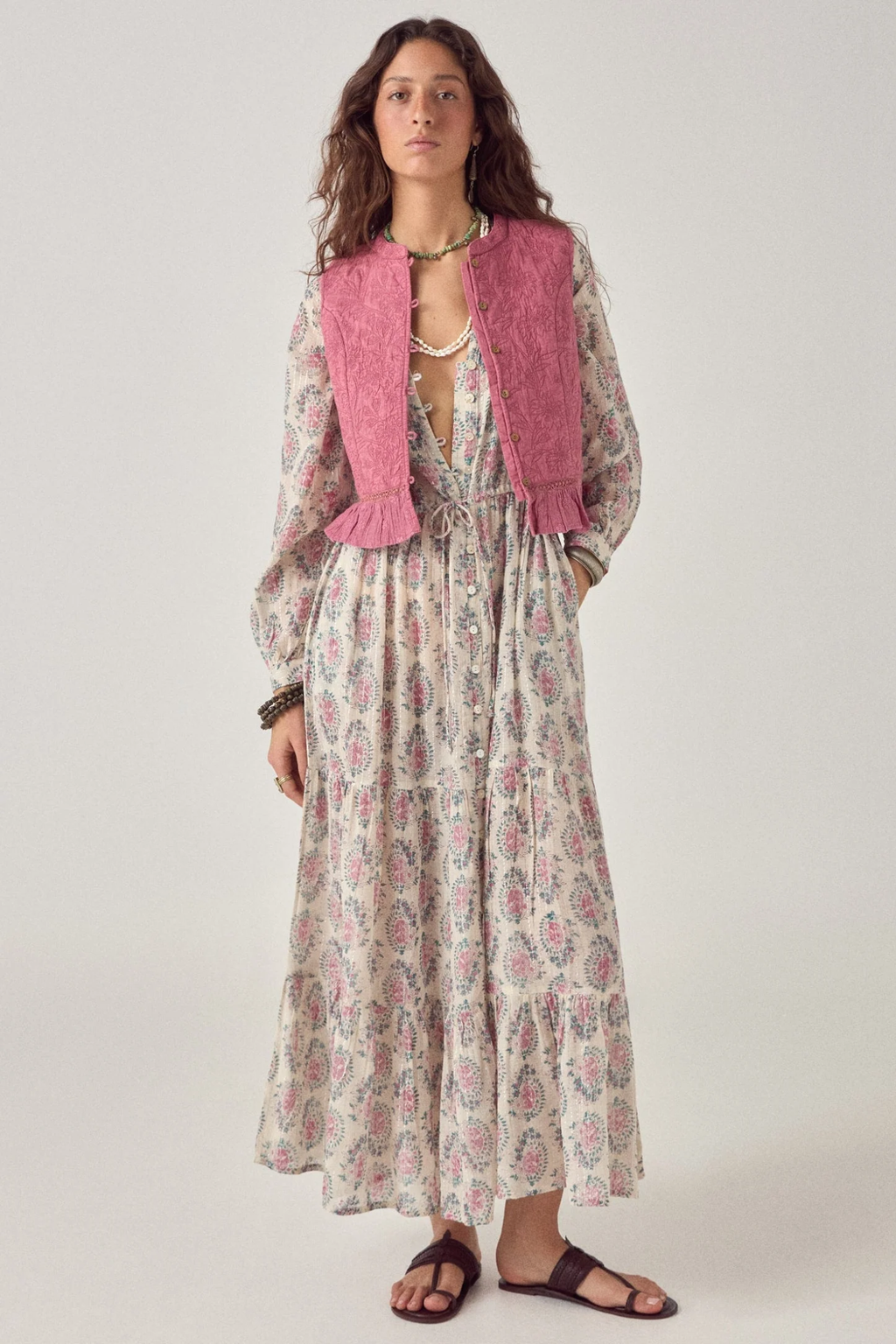 Woman wearing Maison Hotel Mia Vest Peonia Punk Pink layered over floral dress by Maison Hotel, shop Maison Hotel at Dotique