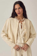 Woman wearing Maison Hotel Otelo Jacket Linen Solstice - Ivory Whisper by Maison Hotel, shop Maison Hotel at Dotique
