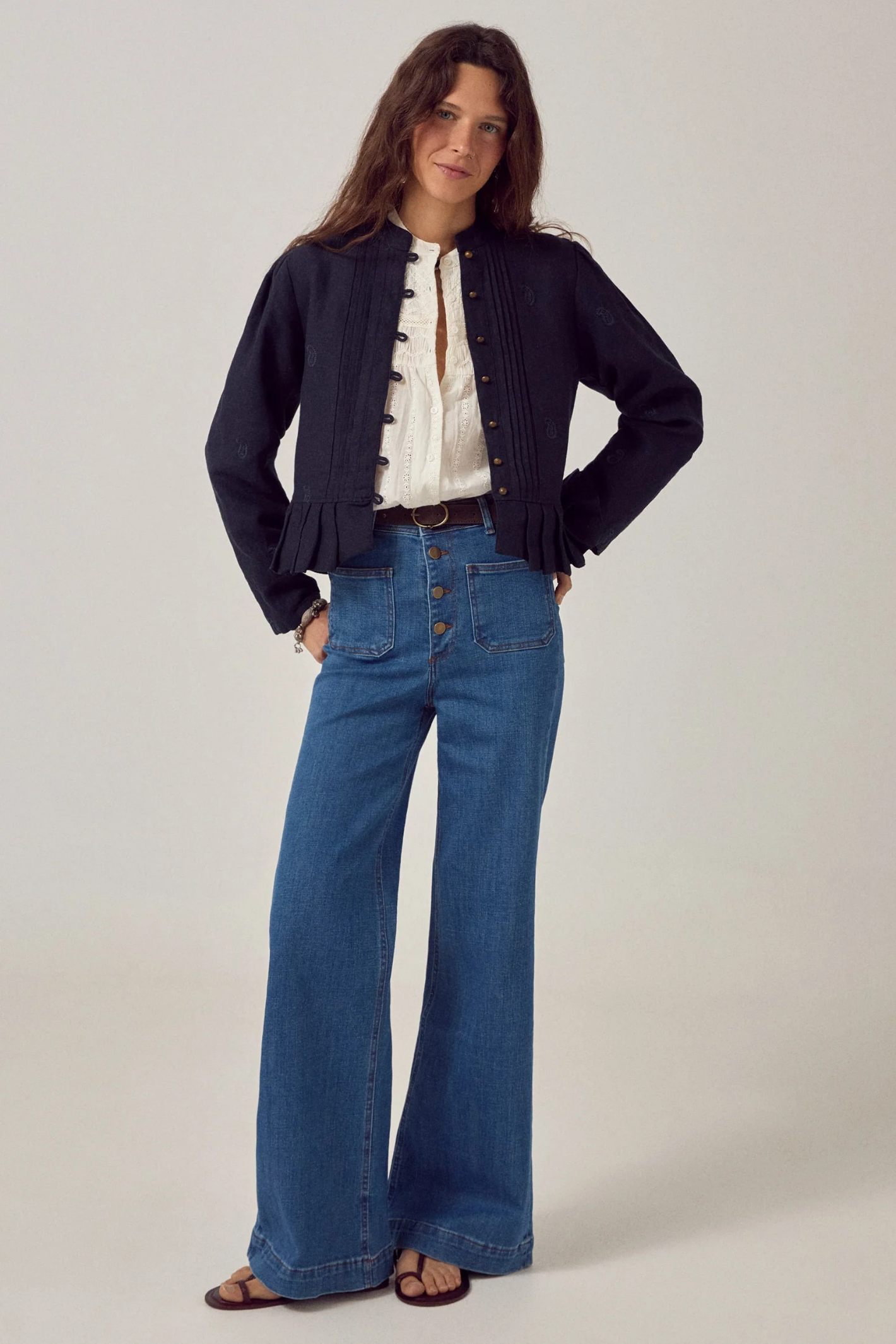 Woman wearing Maison Hotel Paoli Blouse Sapore Di Sale - Bianco styled with jacket and jeans Shop Maison Hotel at Dotique