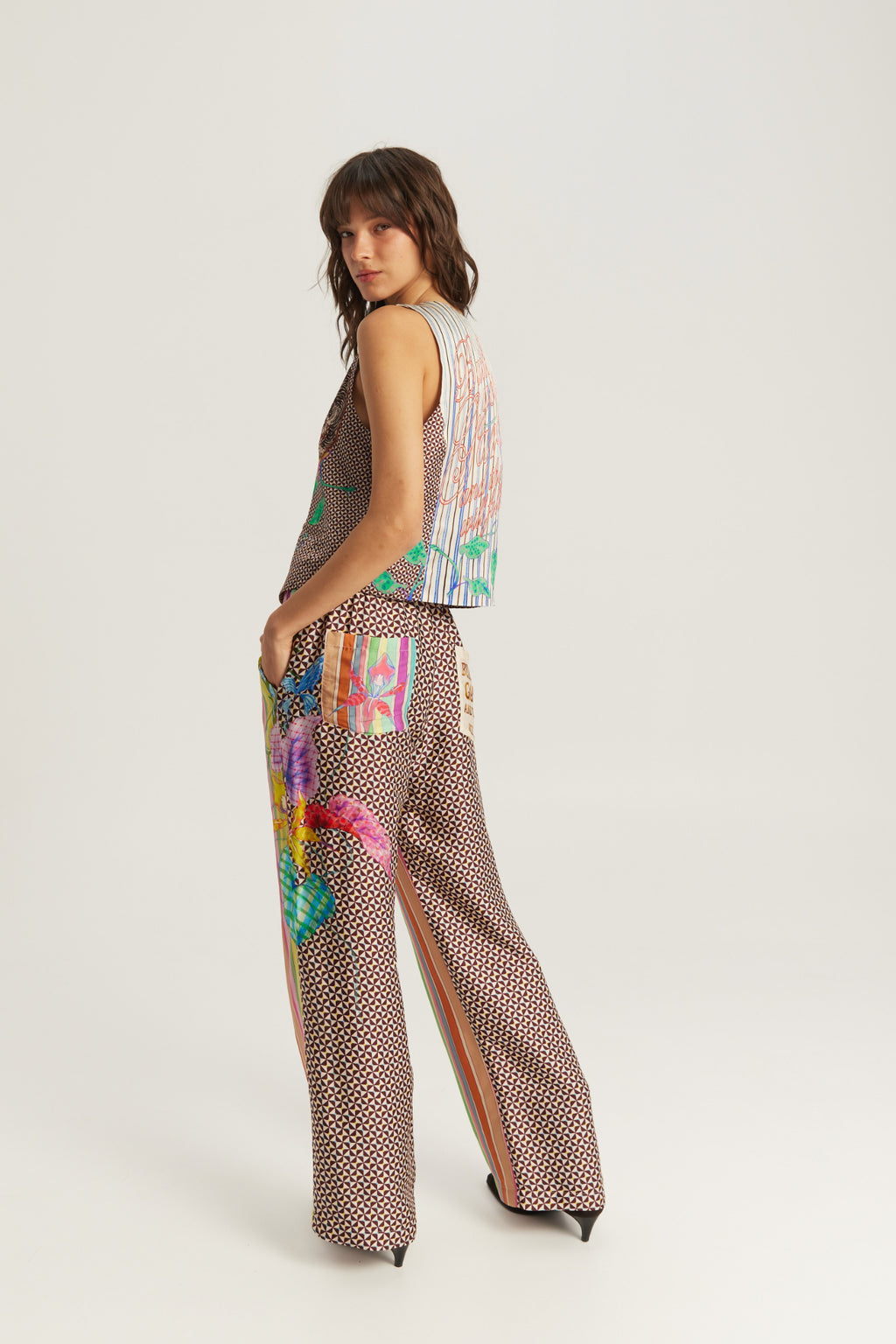 Shop the ME369 Bailey Straight Leg Track Pants in Paradiso at Dotique. Soft viscose blend trousers featuring a vibrant artistic print and relaxed straight-leg fit.