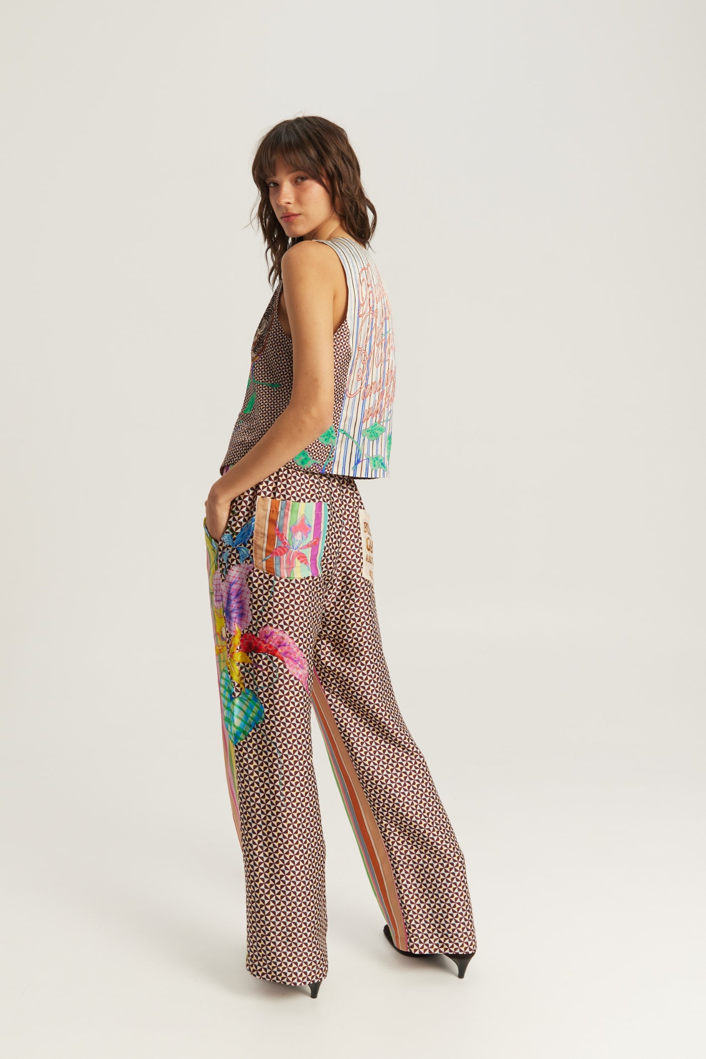 Shop the ME369 Bailey Straight Leg Track Pants in Paradiso at Dotique. Soft viscose blend trousers featuring a vibrant artistic print and relaxed straight-leg fit.