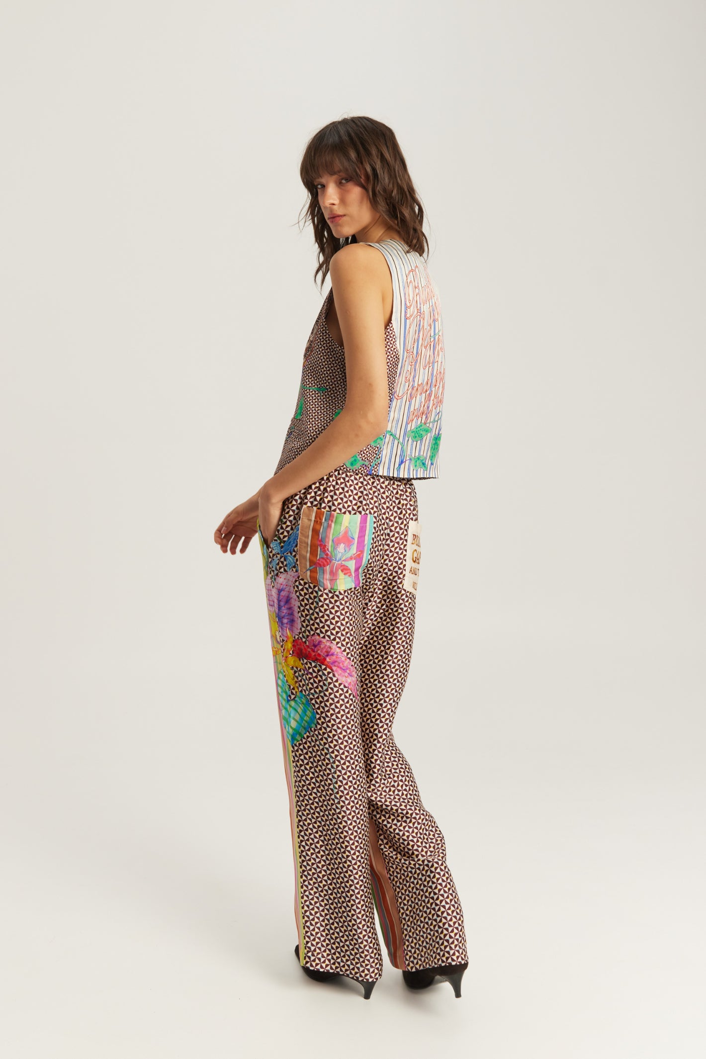 Shop the ME369 Bailey Straight Leg Track Pants in Paradiso at Dotique. Soft viscose blend trousers featuring a vibrant artistic print and relaxed straight-leg fit.