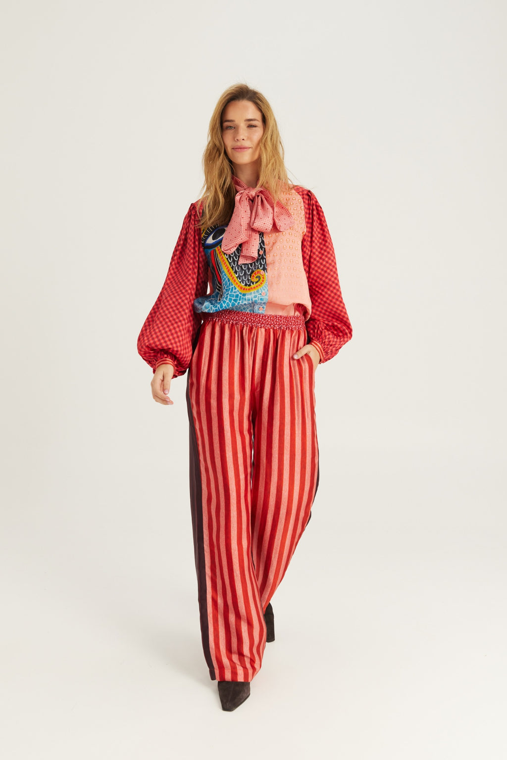 Shop the ME369 Bailey Straight Leg Track Pants in Red Aura at Dotique. Soft viscose blend trousers with a relaxed straight-leg fit and signature statement detailing.