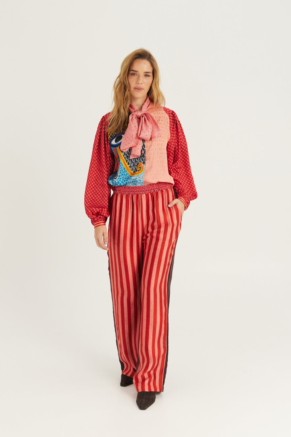 Shop the ME369 Bailey Straight Leg Track Pants in Red Aura at Dotique. Soft viscose blend trousers with a relaxed straight-leg fit and signature statement detailing.