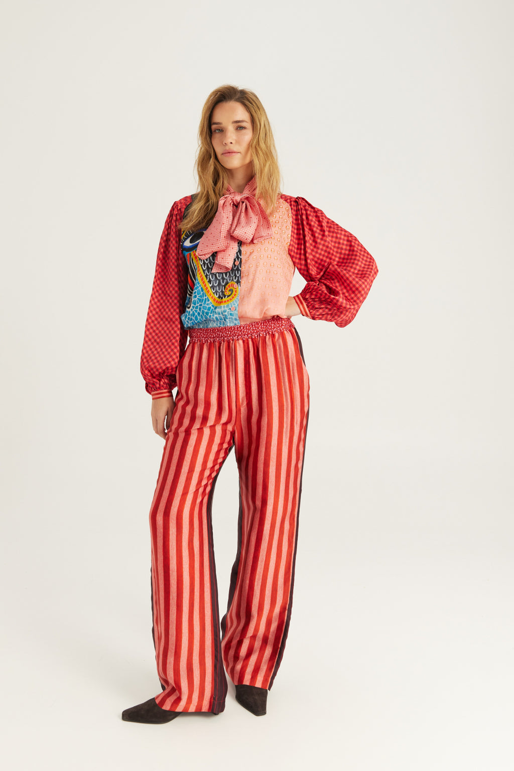Shop the ME369 Bailey Straight Leg Track Pants in Red Aura at Dotique. Soft viscose blend trousers with a relaxed straight-leg fit and signature statement detailing.