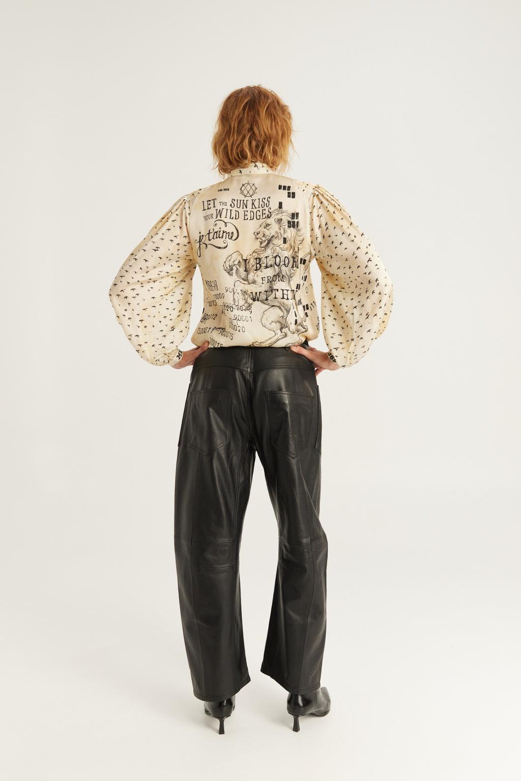 Shop the ME369 Nola Printed Tie Shirt in Noir Muse at Dotique. A printed blouse with a statement tie neckline, voluminous sleeves and a soft viscose blend.