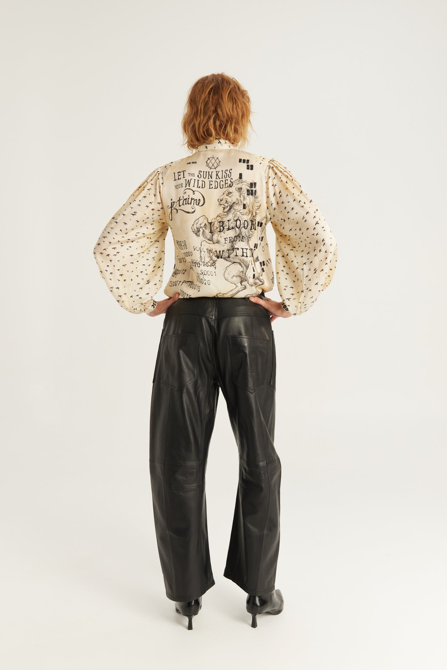 Shop the ME369 Nola Printed Tie Shirt in Noir Muse at Dotique. A printed blouse with a statement tie neckline, voluminous sleeves and a soft viscose blend.