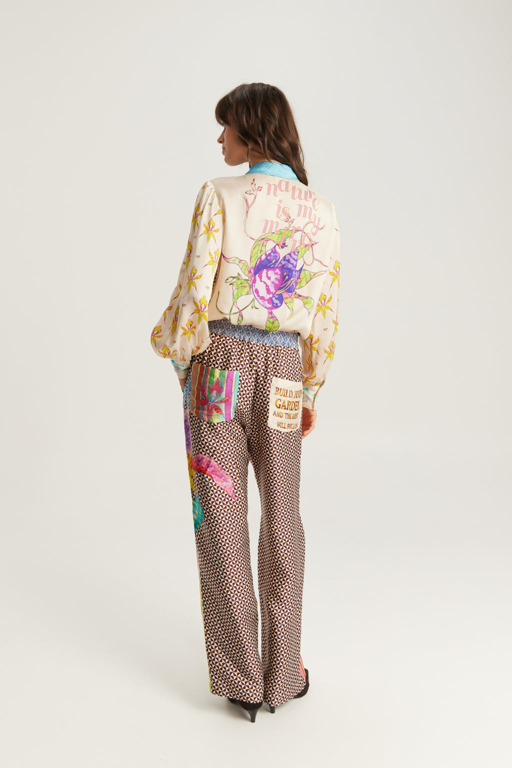 Shop the ME369 Sola Printed Puff Sleeve Blouse in Paradiso at Dotique. A soft printed blouse with puff sleeves, colourful artwork and signature ME369 styling.