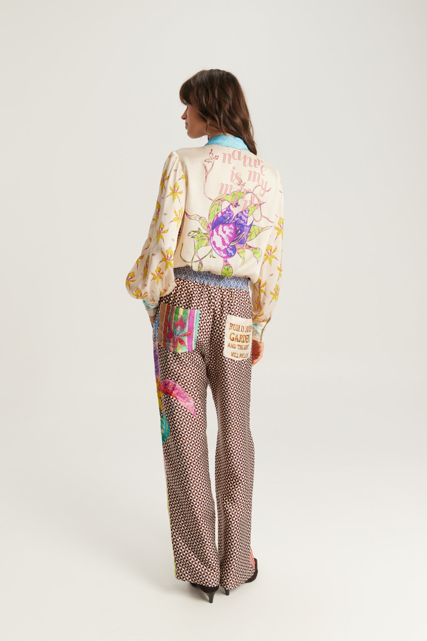 Shop the ME369 Sola Printed Puff Sleeve Blouse in Paradiso at Dotique. A soft printed blouse with puff sleeves, colourful artwork and signature ME369 styling.