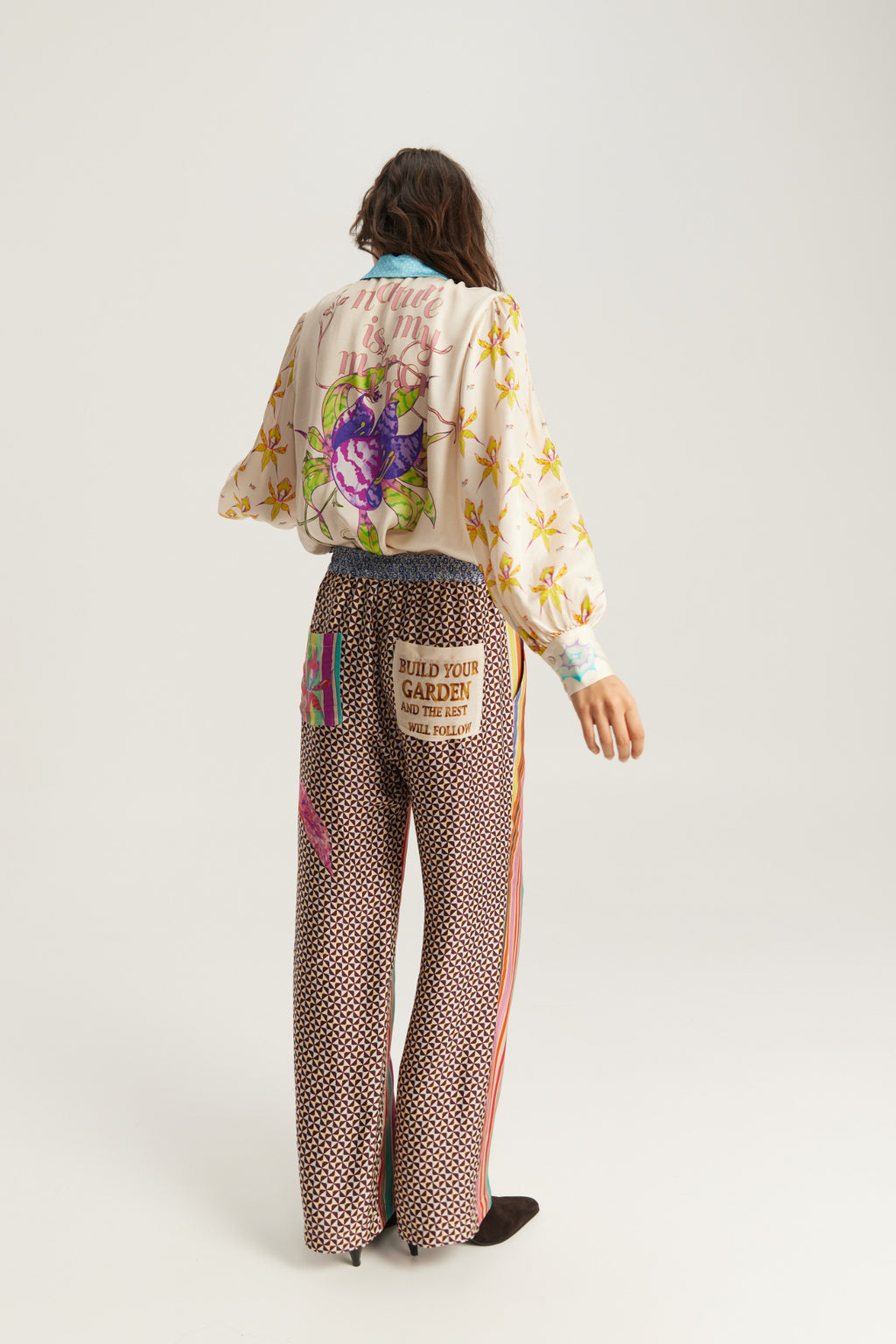 Shop the ME369 Sola Printed Puff Sleeve Blouse in Paradiso at Dotique. A soft printed blouse with puff sleeves, colourful artwork and signature ME369 styling.