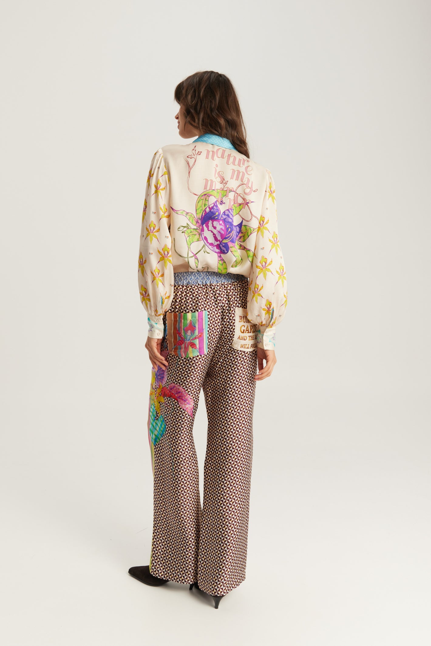 Shop the ME369 Sola Printed Puff Sleeve Blouse in Paradiso at Dotique. A soft printed blouse with puff sleeves, colourful artwork and signature ME369 styling.