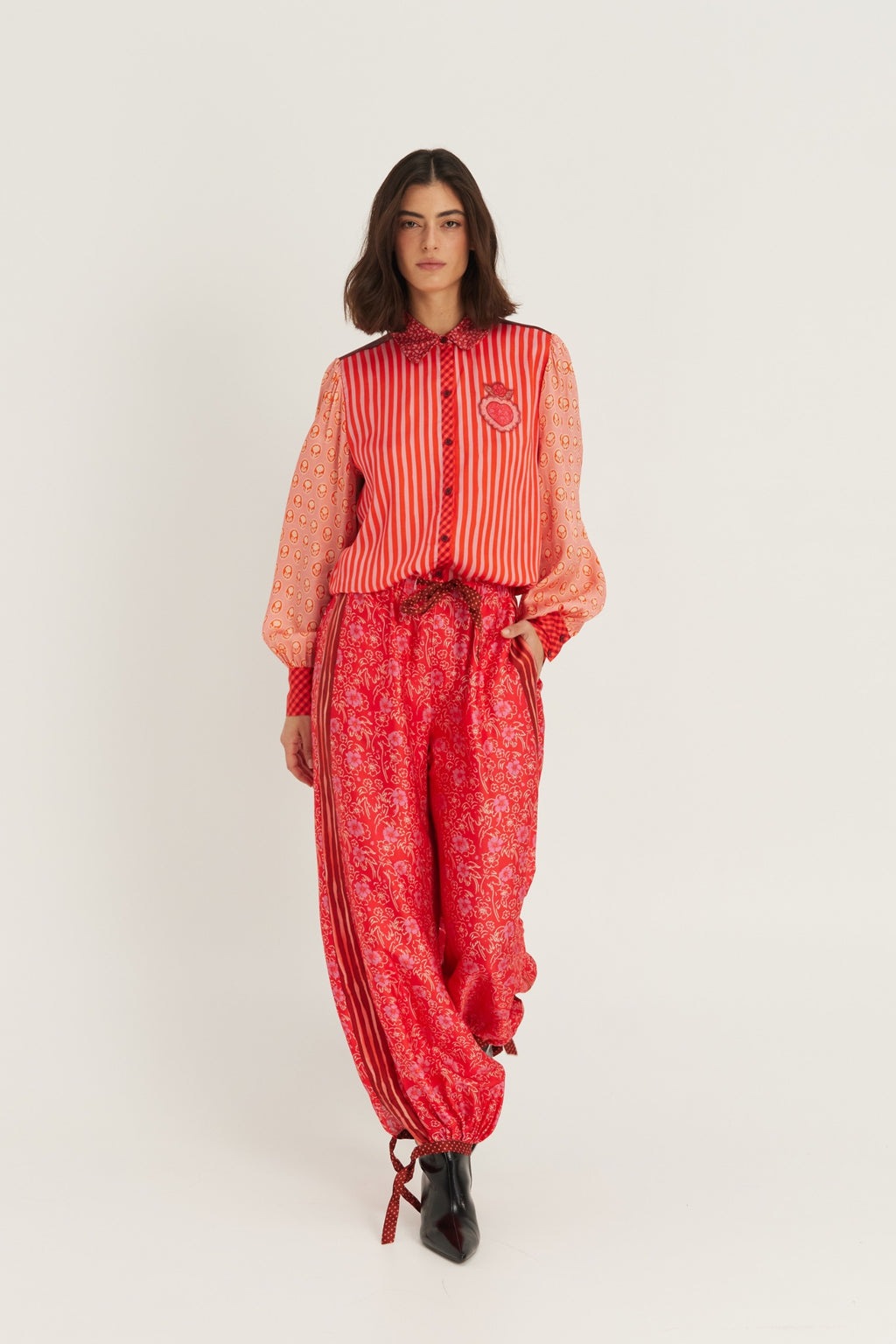 Shop the ME369 Sola Printed Puff Sleeve Blouse in Red Aura at Dotique. A soft printed blouse with puff sleeves, vibrant colours and signature ME369 detailing.