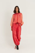 Shop the ME369 Sola Printed Puff Sleeve Blouse in Red Aura at Dotique. A soft printed blouse with puff sleeves, vibrant colours and signature ME369 detailing.