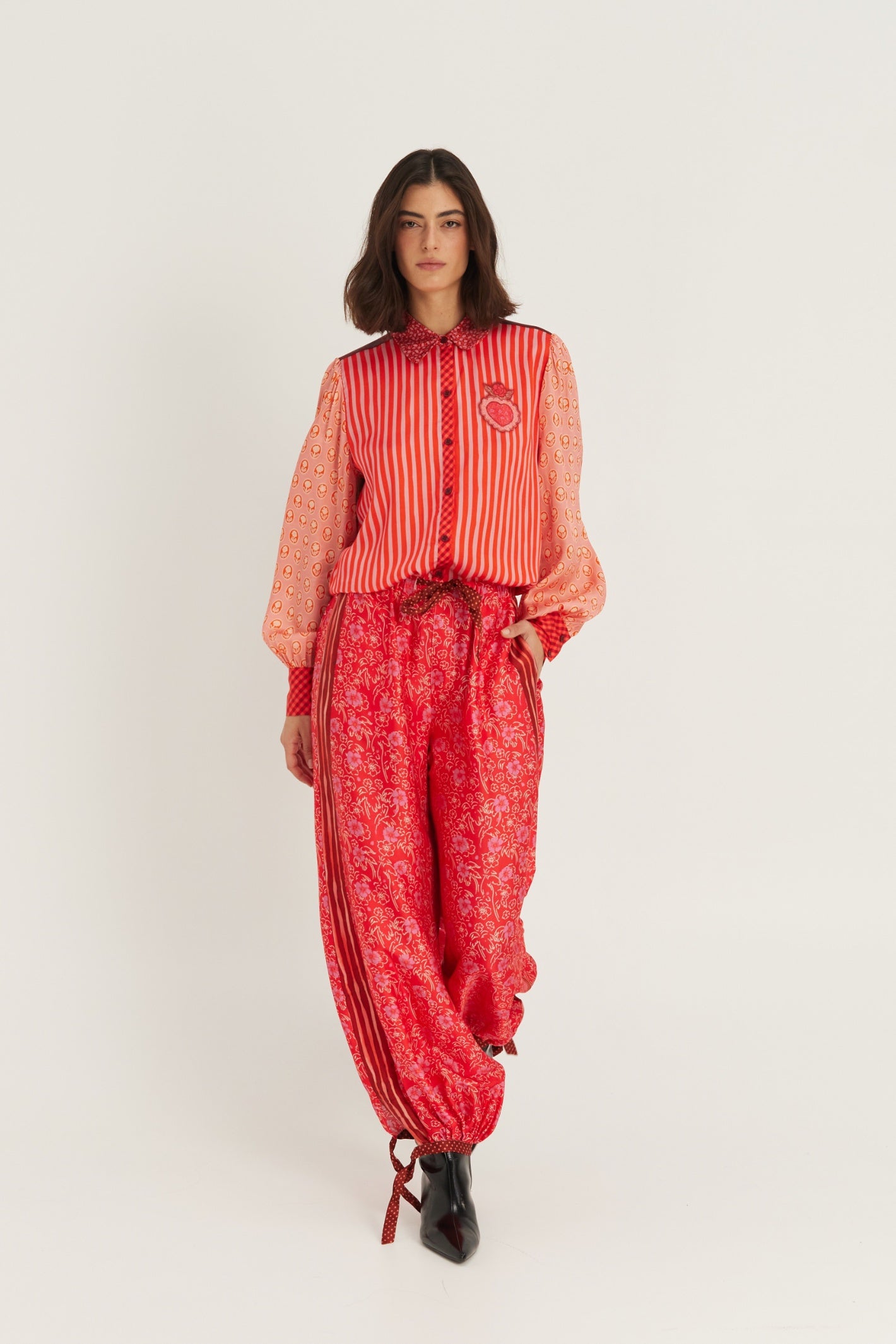 Shop the ME369 Sola Printed Puff Sleeve Blouse in Red Aura at Dotique. A soft printed blouse with puff sleeves, vibrant colours and signature ME369 detailing.