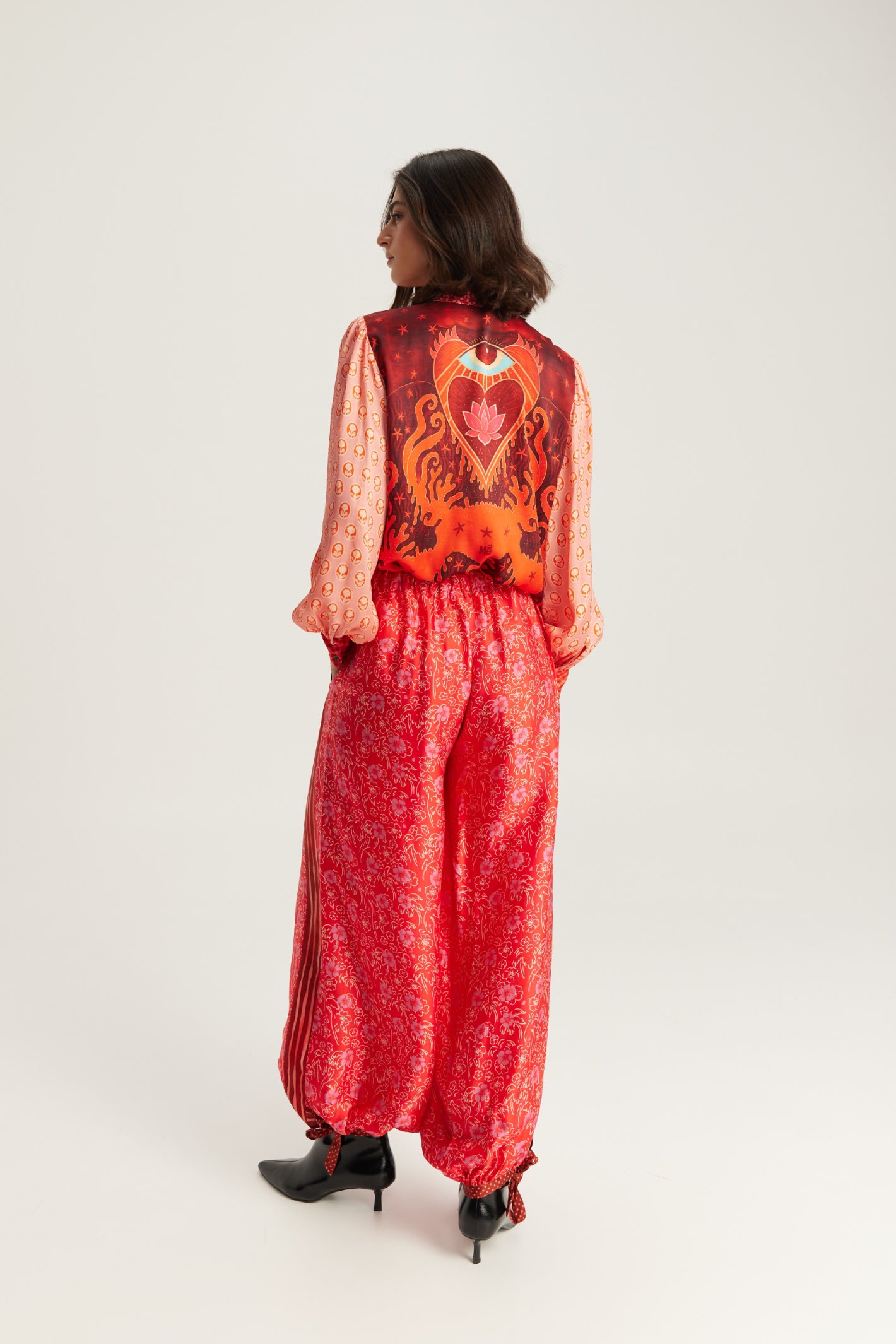 Shop the ME369 Sola Printed Puff Sleeve Blouse in Red Aura at Dotique. A soft printed blouse with puff sleeves, vibrant colours and signature ME369 detailing.
