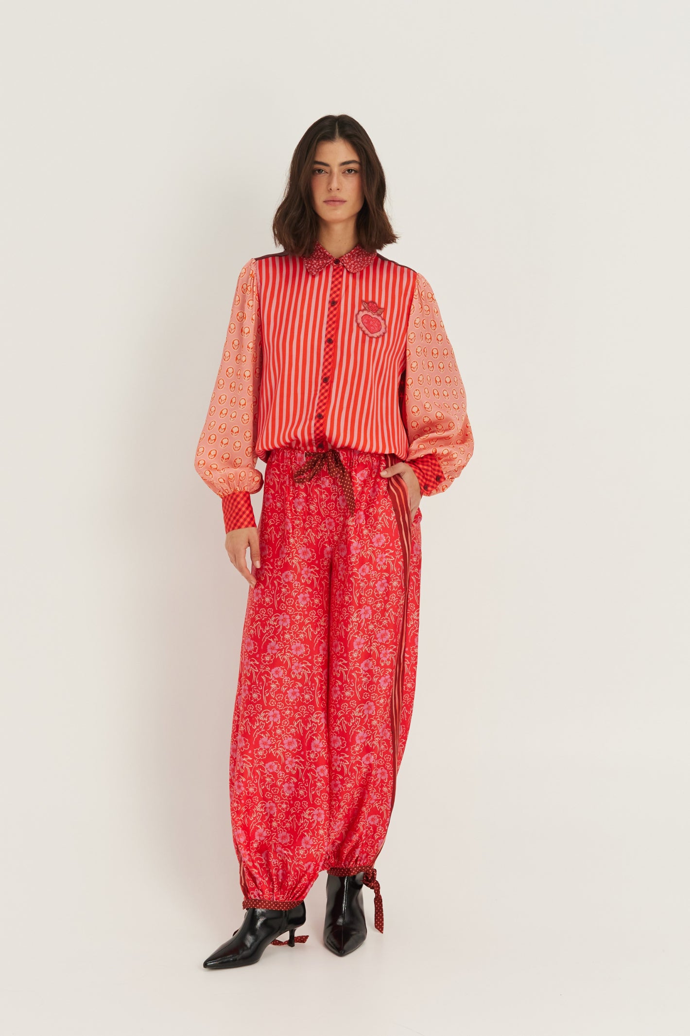 Shop the ME369 Sola Printed Puff Sleeve Blouse in Red Aura at Dotique. A soft printed blouse with puff sleeves, vibrant colours and signature ME369 detailing.