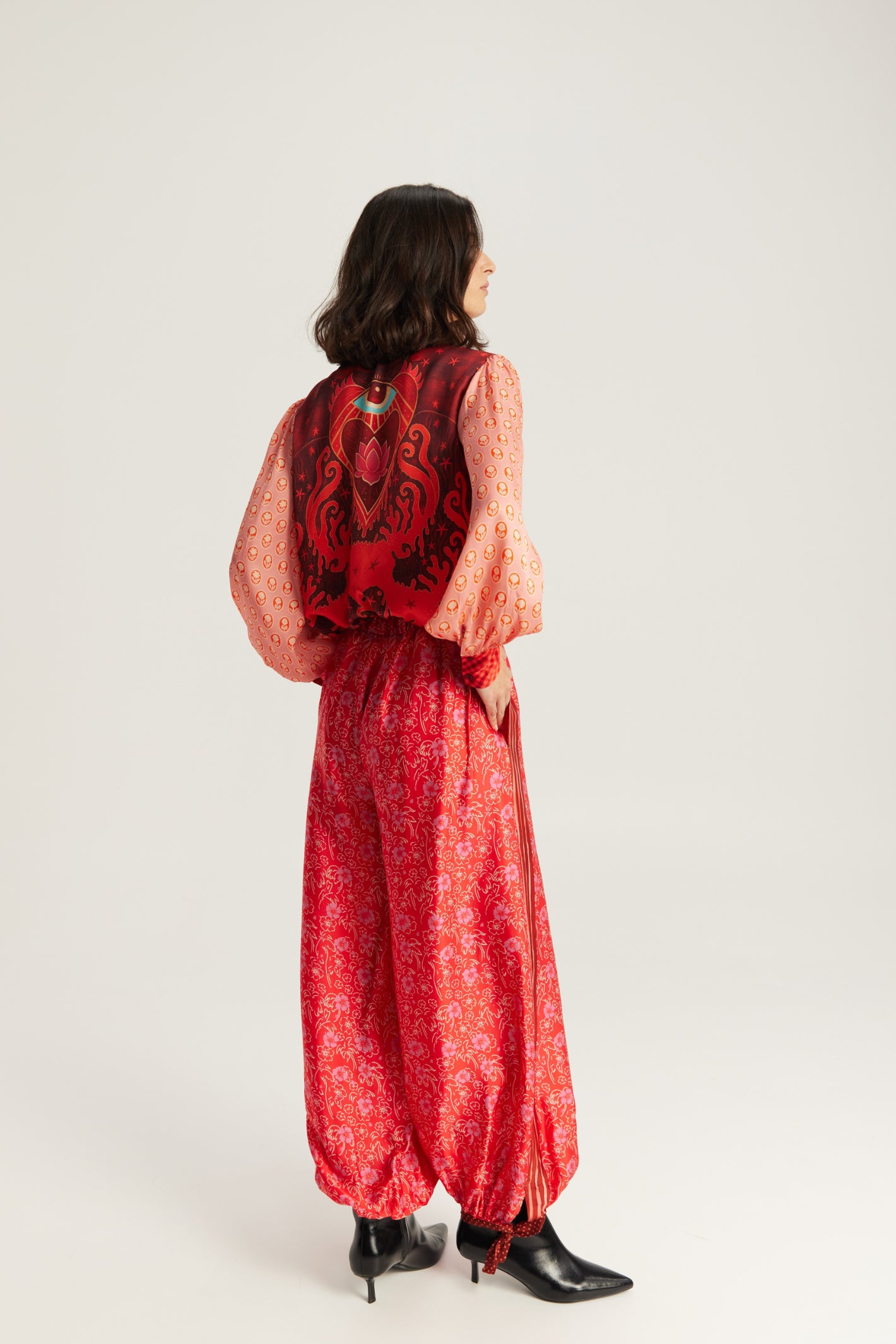 Shop the ME369 Sola Printed Puff Sleeve Blouse in Red Aura at Dotique. A soft printed blouse with puff sleeves, vibrant colours and signature ME369 detailing.