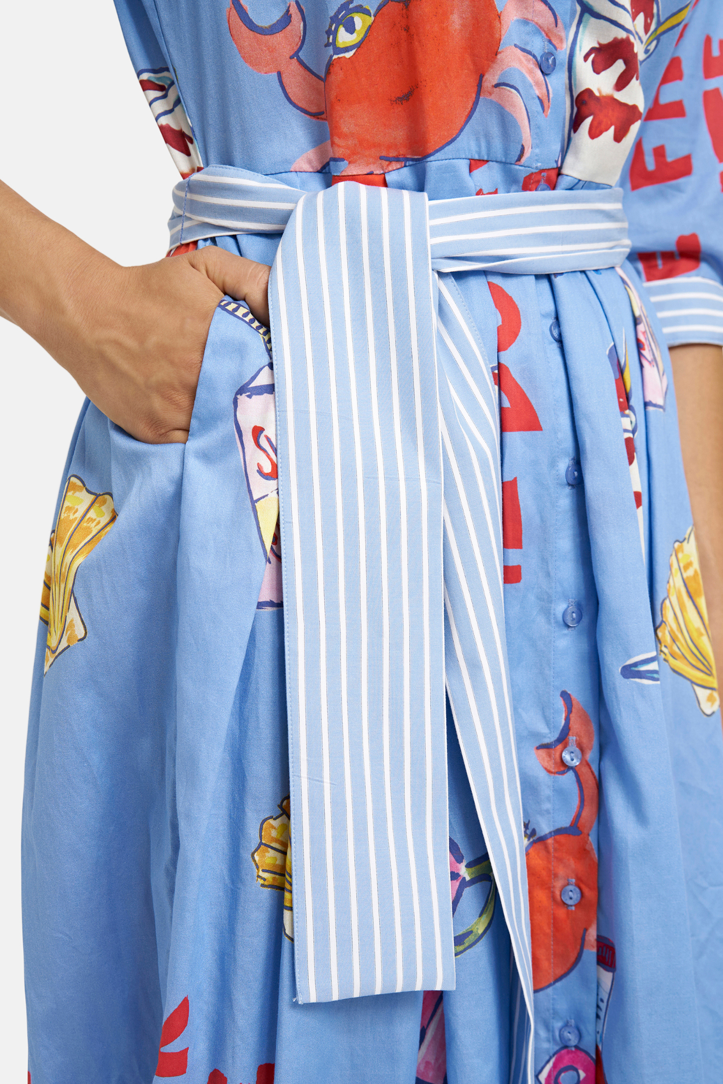 Close-up of pocket and striped tie belt on Milano 61-2432-1371 Ocean Print Shirt Dress with Wide Midi Skirt by MILANO, shop MILANO at Dotique