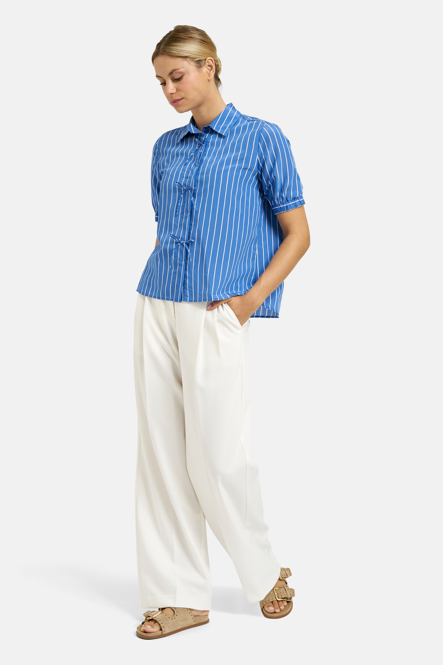 Model wearing Milano 61-4839-6089 Shirt Blouse with Bow Placket – Blue Print by MILANO, shop MILANO at Dotique online store