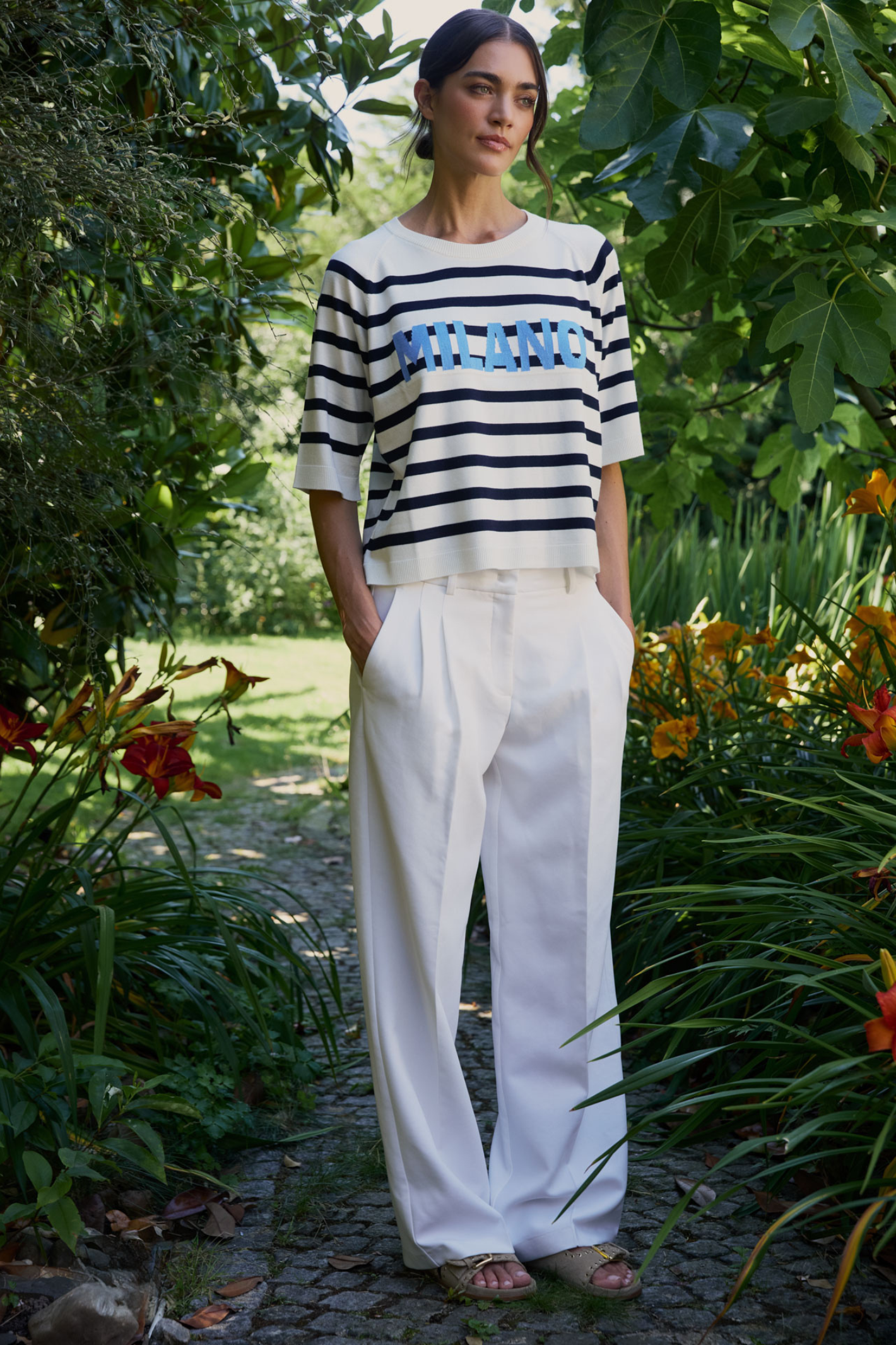Model in garden wearing Milano 61-5048-9111 Navy & White Milano Stripe Jumper by MILANO, shop MILANO at Dotique