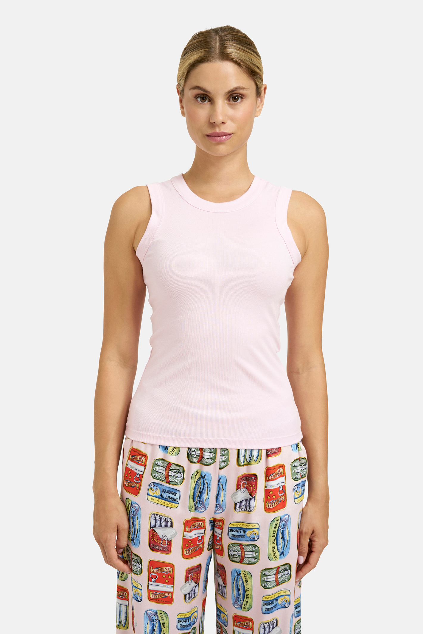 A simple Milano tank top designed as a versatile layering piece. Shop Milano at Dotique.