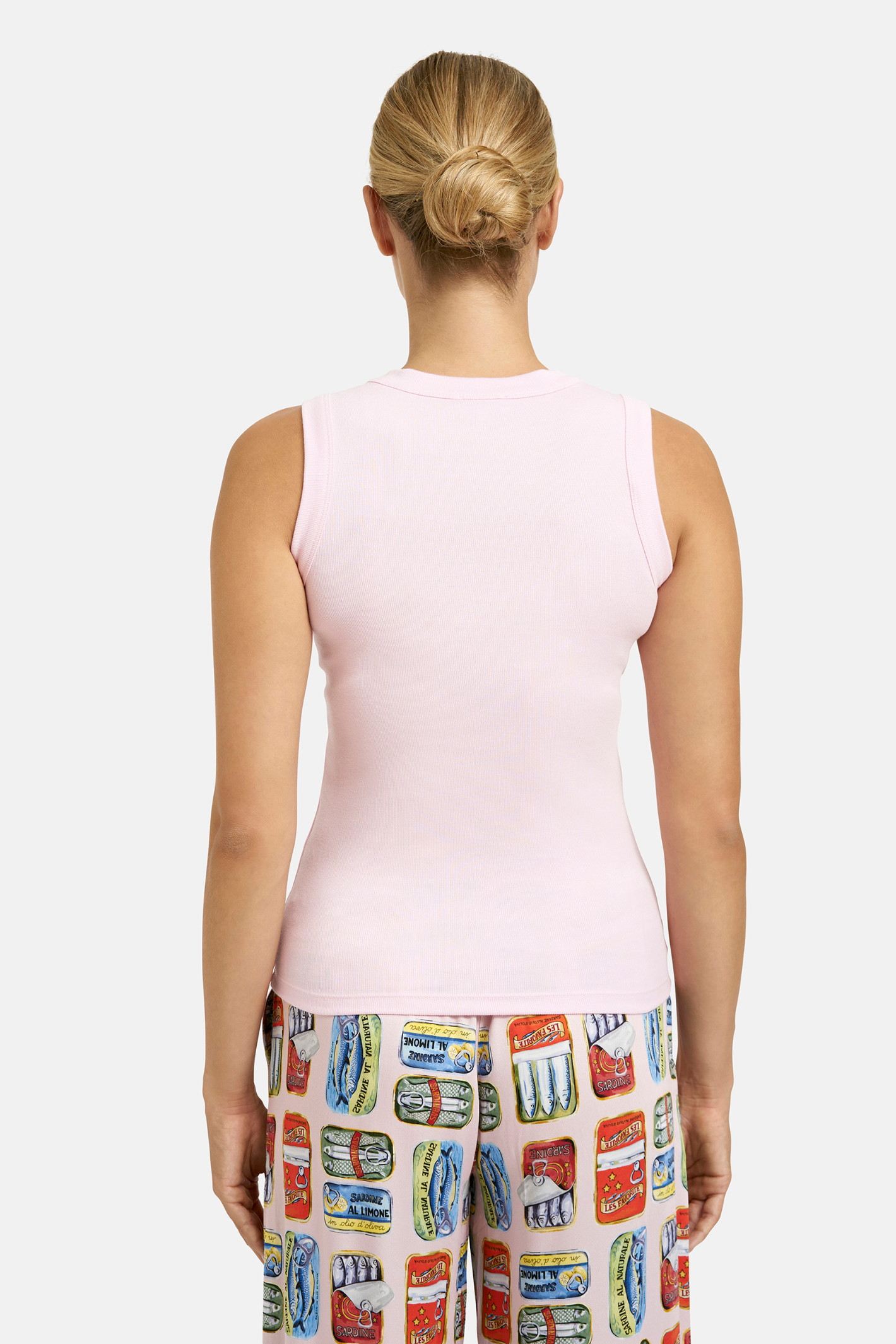 A simple Milano tank top designed as a versatile layering piece. Shop Milano at Dotique.