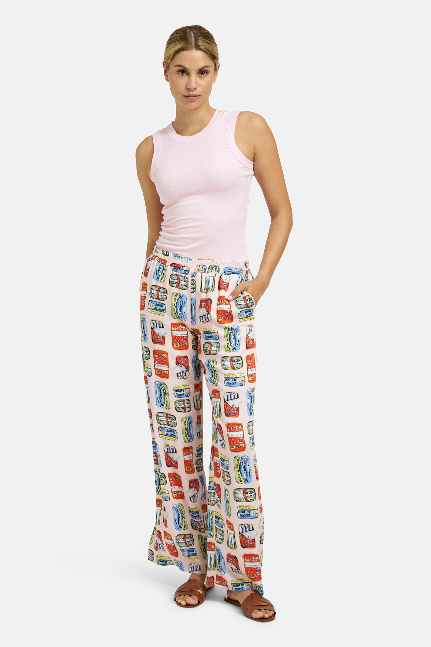 A simple Milano tank top designed as a versatile layering piece. Shop Milano at Dotique.