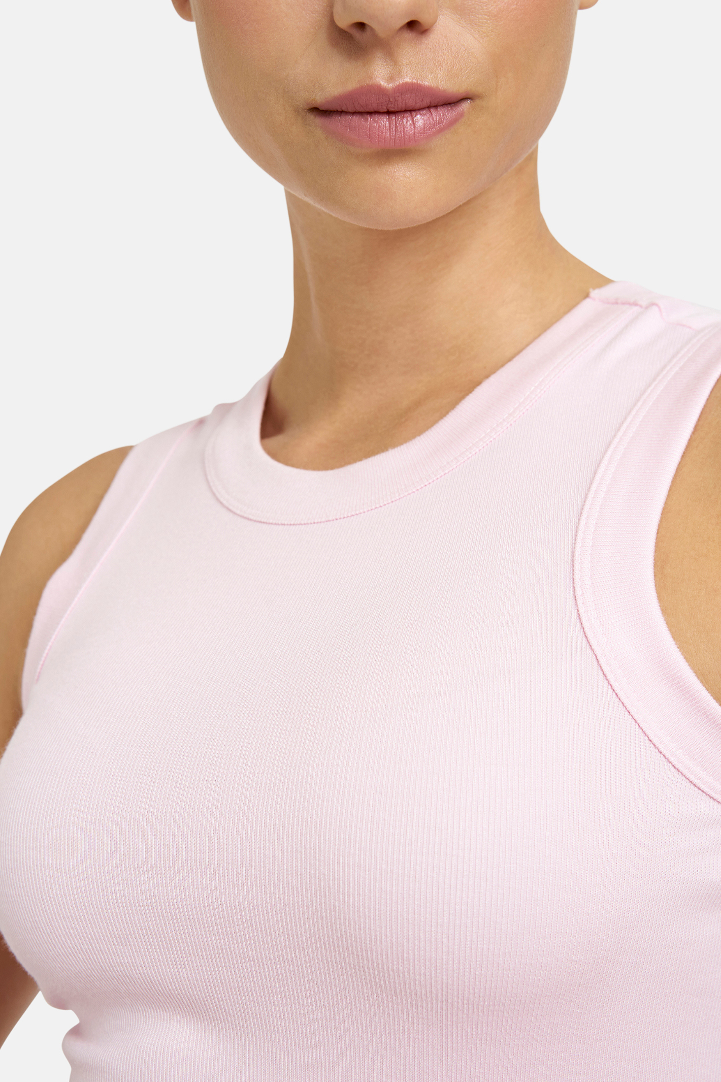 A simple Milano tank top designed as a versatile layering piece. Shop Milano at Dotique.