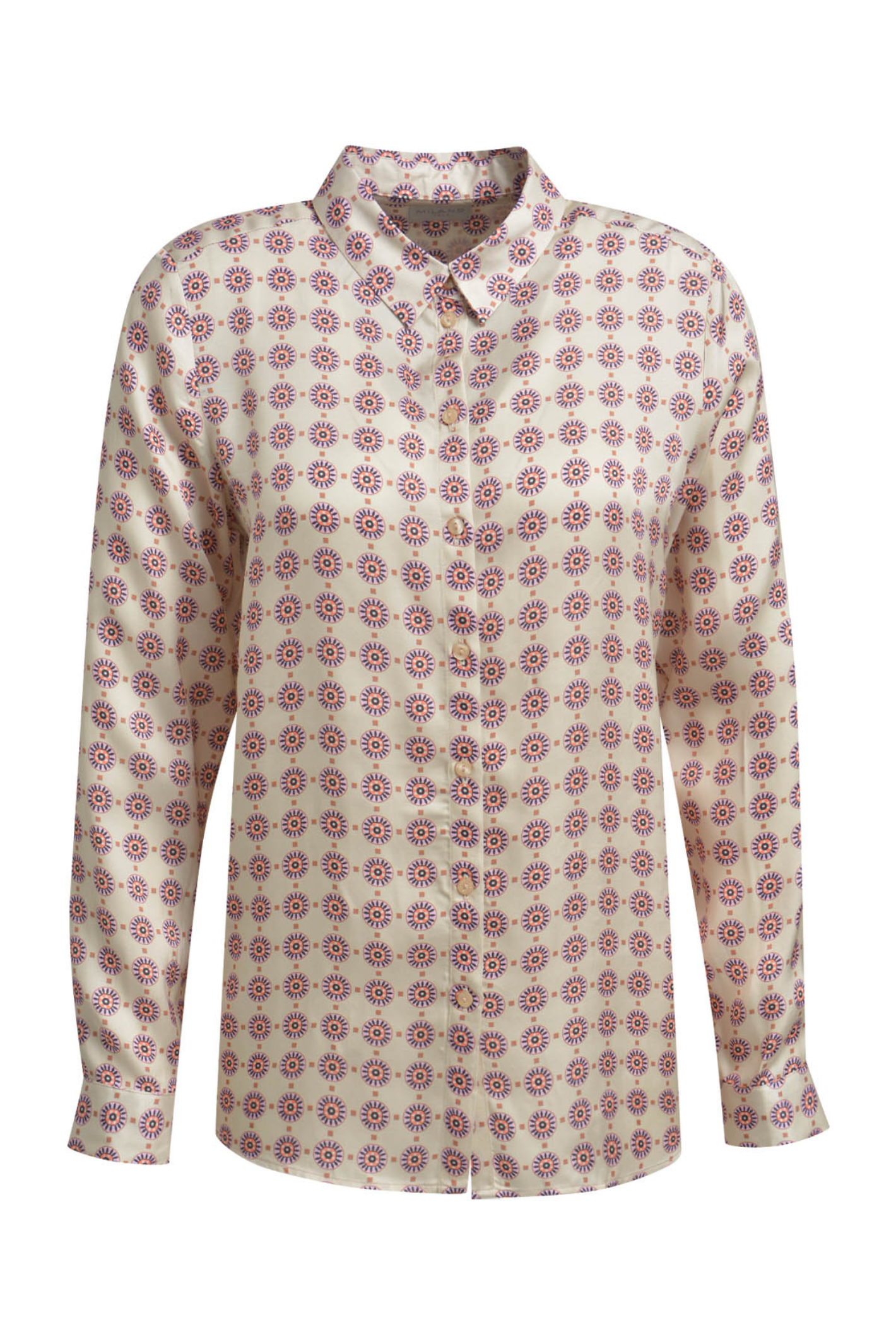 A versatile Milano blouse featuring a soft nude print and long sleeves. Shop now at Dotique.