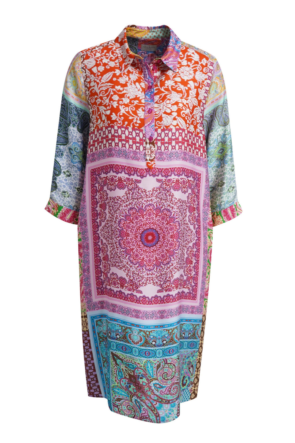 A long-sleeved button-up tunic dress featuring a vibrant patchwork print of various traditional patterns, including a central pink mandala, orange floral motifs, and turquoise paisley, displayed on a clean white background.