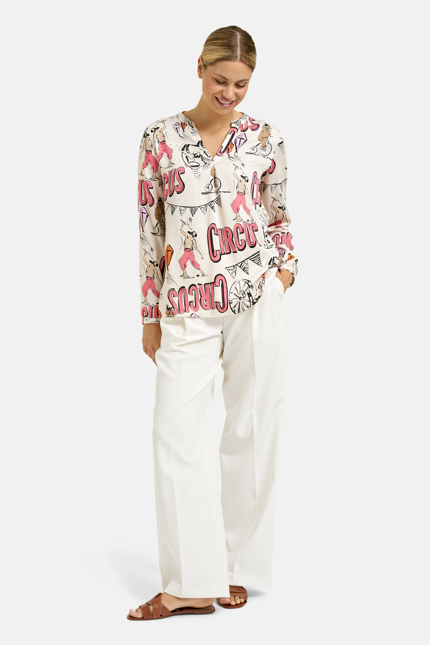 Woman wearing Milano Italy 61-6506-3061 Cream Print V-Neck Blouse by MILANO, shop MILANO at Dotique online.