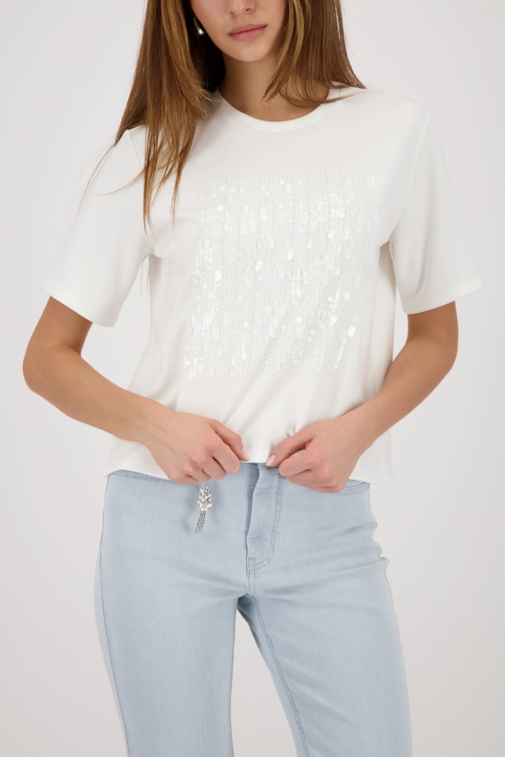 Monari 410124 Sequin Detail T-Shirt in Off-White worn by model with light jeans Shop Monari at Dotique