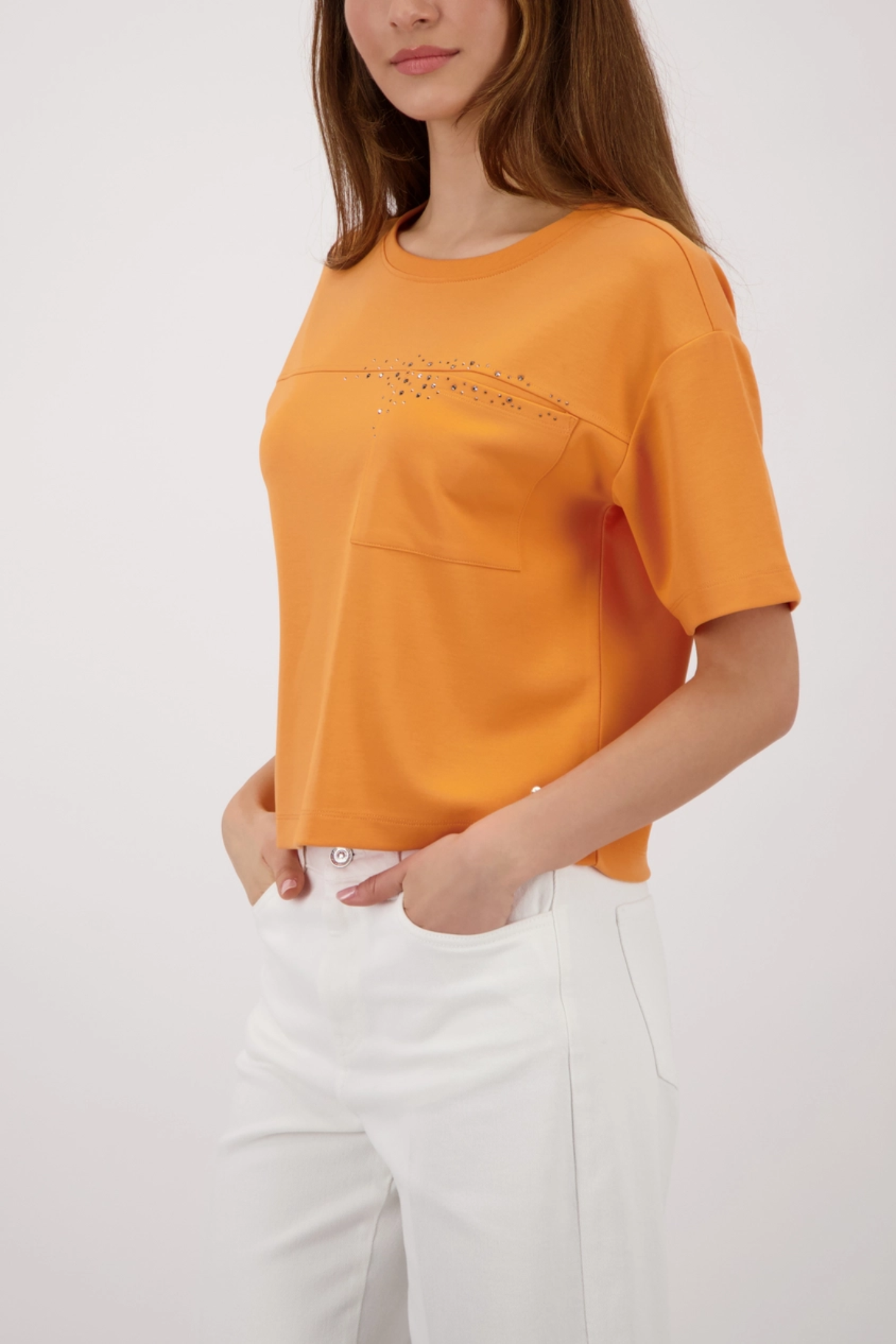 Monari 410127 Sweatshirt with Rhinestones Orange styled on model, shop Monari at Dotique for vibrant casual wear.