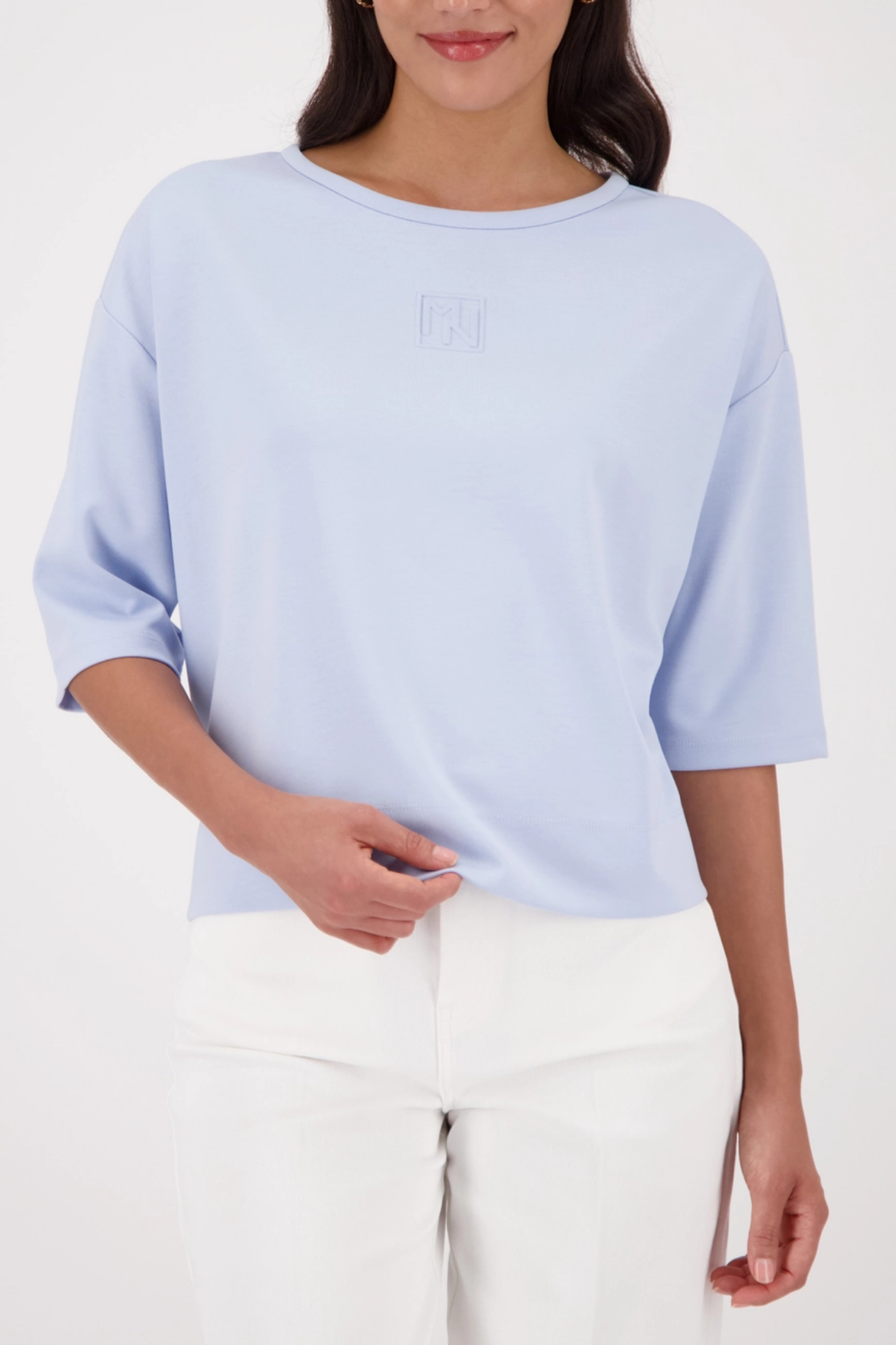 Monari 410185 Pale Blue Embossed Emblem Sweatshirt worn by model, shop Monari at Dotique for modern casual style