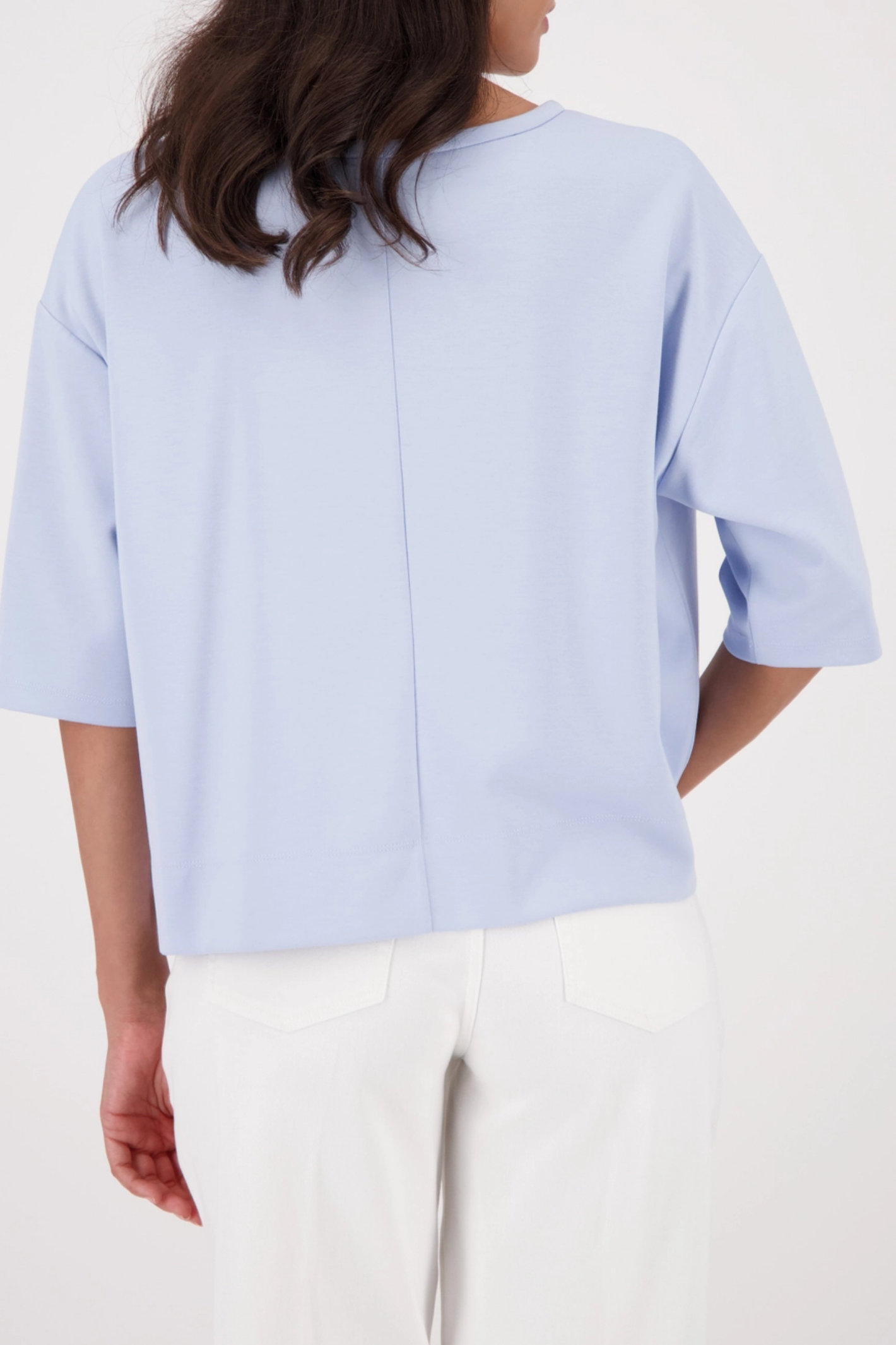 Monari 410185 Pale Blue Embossed Emblem Sweatshirt back view styled on model Shop Monari at Dotique