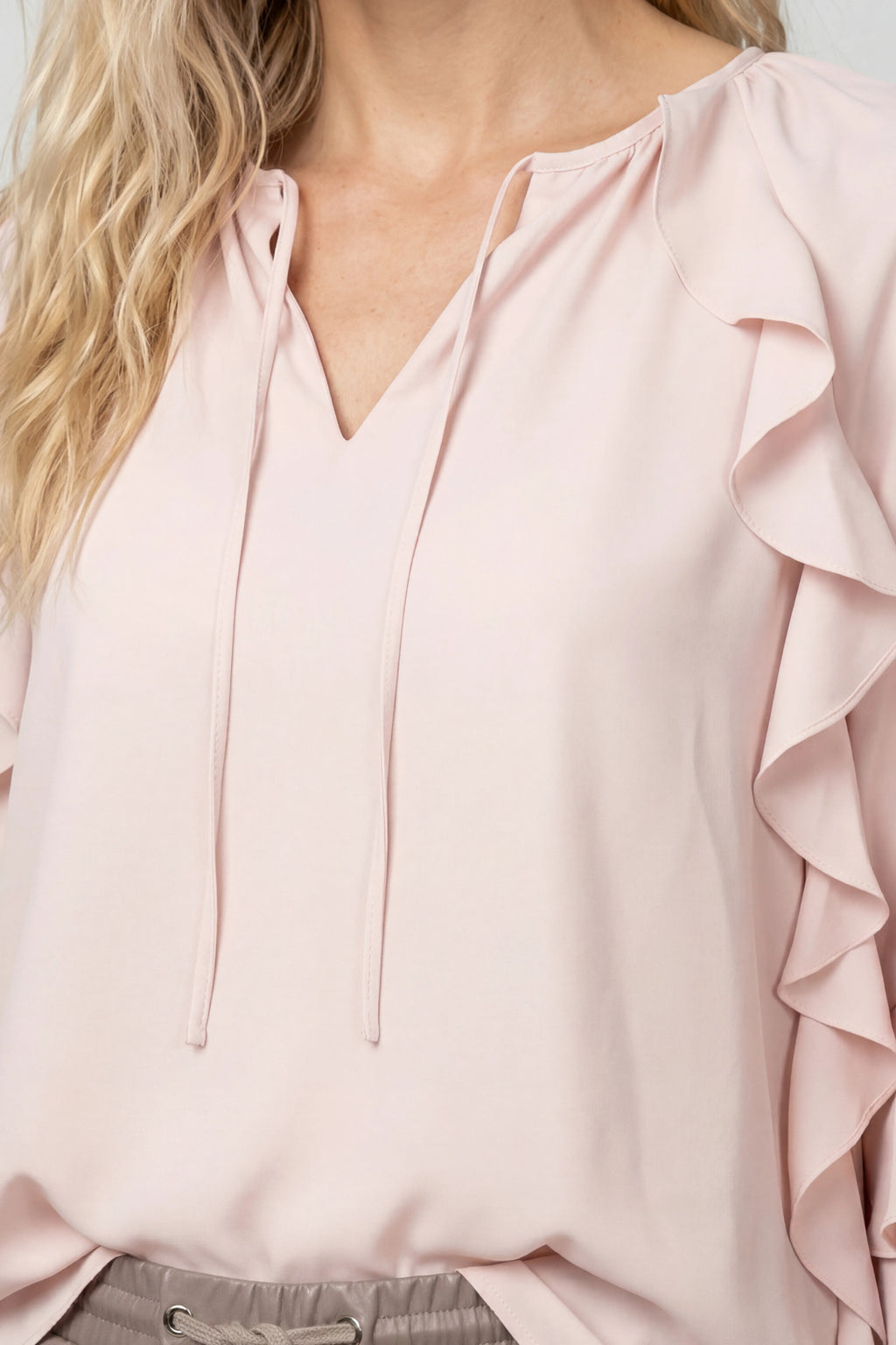 Close-up of pale pink Monari 809721 Blouse Rosewater with ruffle detail, shop Monari at Dotique for elegant styles
