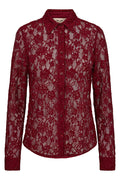 Red lace blouse on a white background