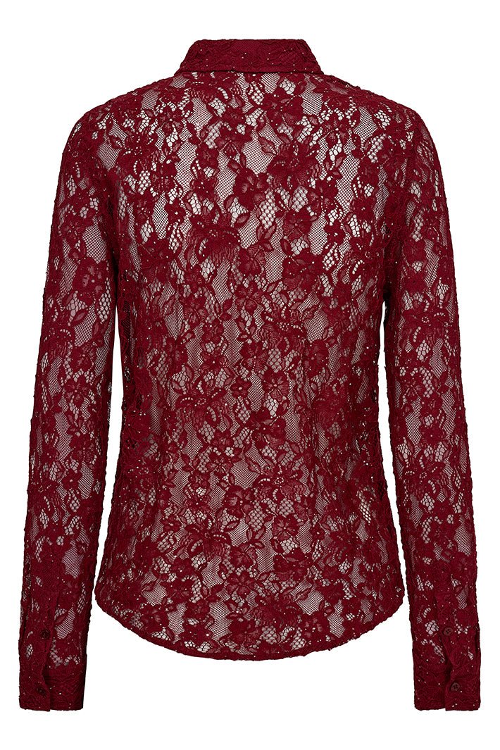Red lace blouse on a white background