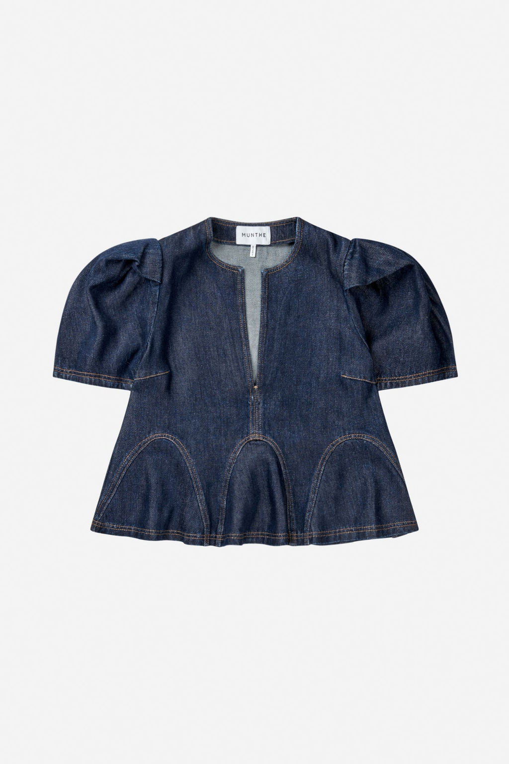 Shop the MUNTHE Baynor Top in Indigo at Dotique. Crafted from 100% TENCEL™ with contrast stitching, puff sleeves and a flattering A-line silhouette.