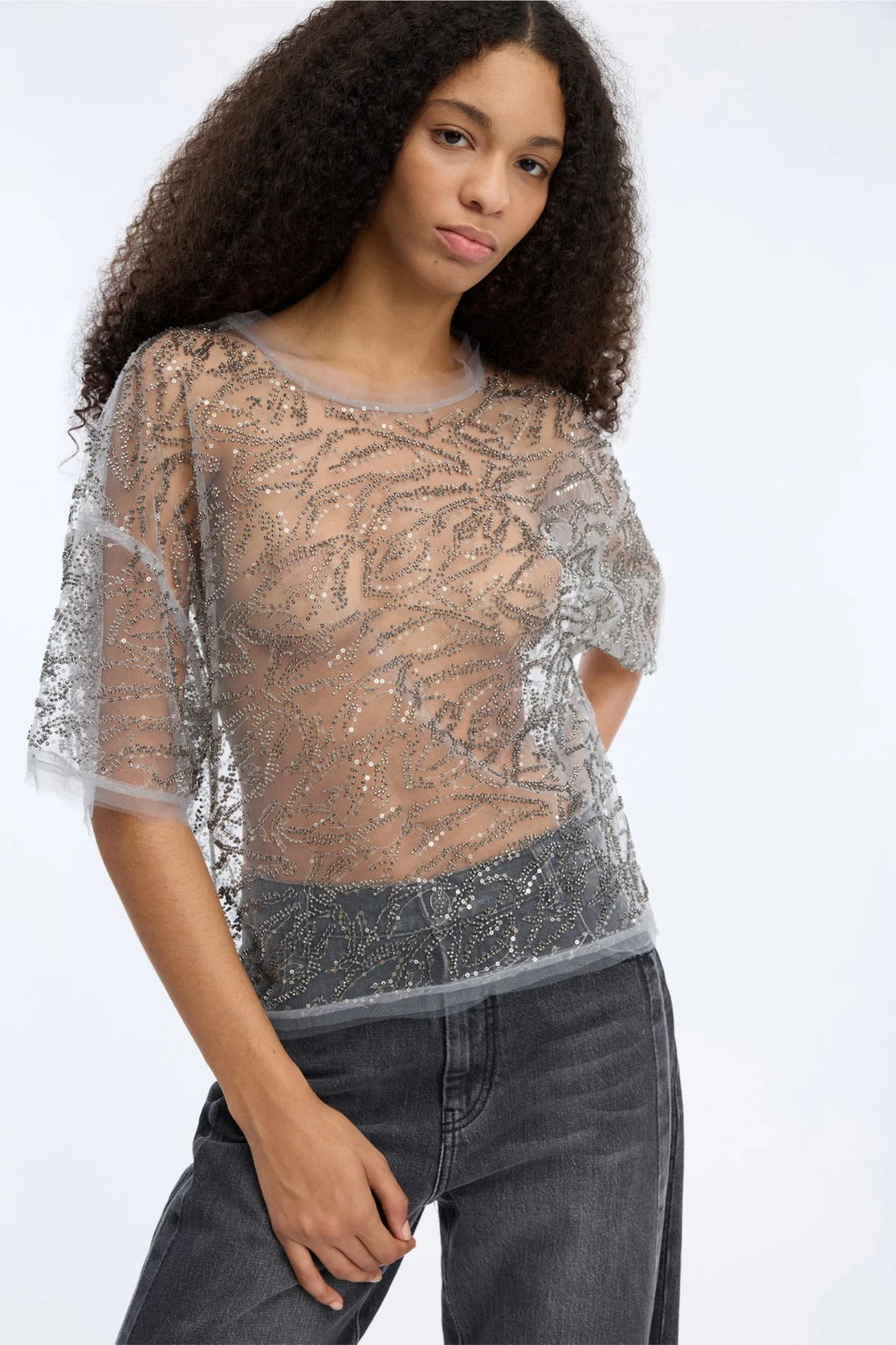 Shop the MUNTHE Vun Top in Gun Metal at Dotique. A beautifully draped metallic top with a relaxed fit, perfect for parties, evenings out and special occasions.