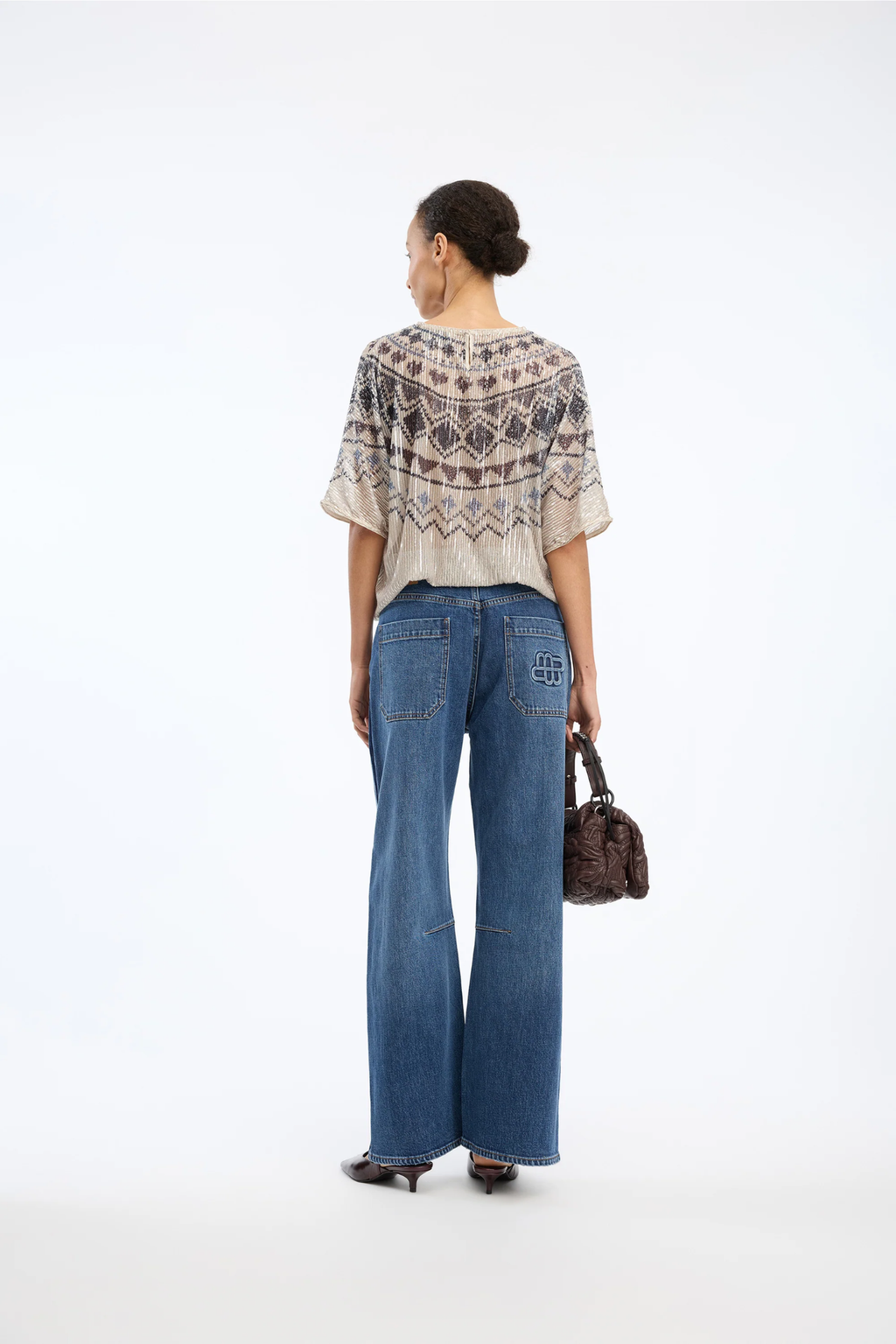Shop the MUNTHE Vunny Top in Print Camel at Dotique. A beautifully draped printed top featuring MUNTHE's signature print, designed for effortless day-to-evening dressing.