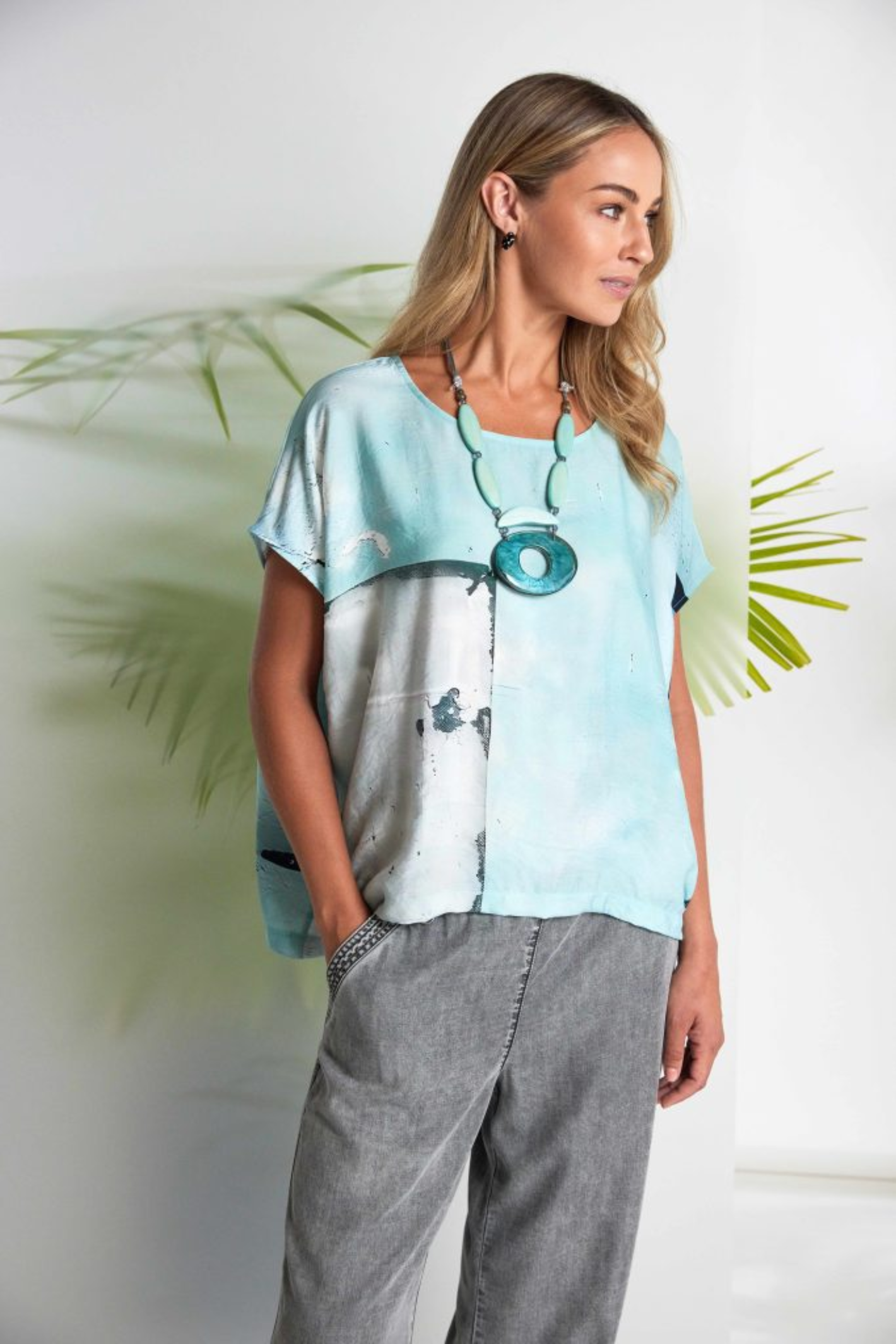 Model wearing Naya NAS26137 Granite Grey Wide Leg Pull-On Trousers by Naya in relaxed pose, shop Naya at Dotique