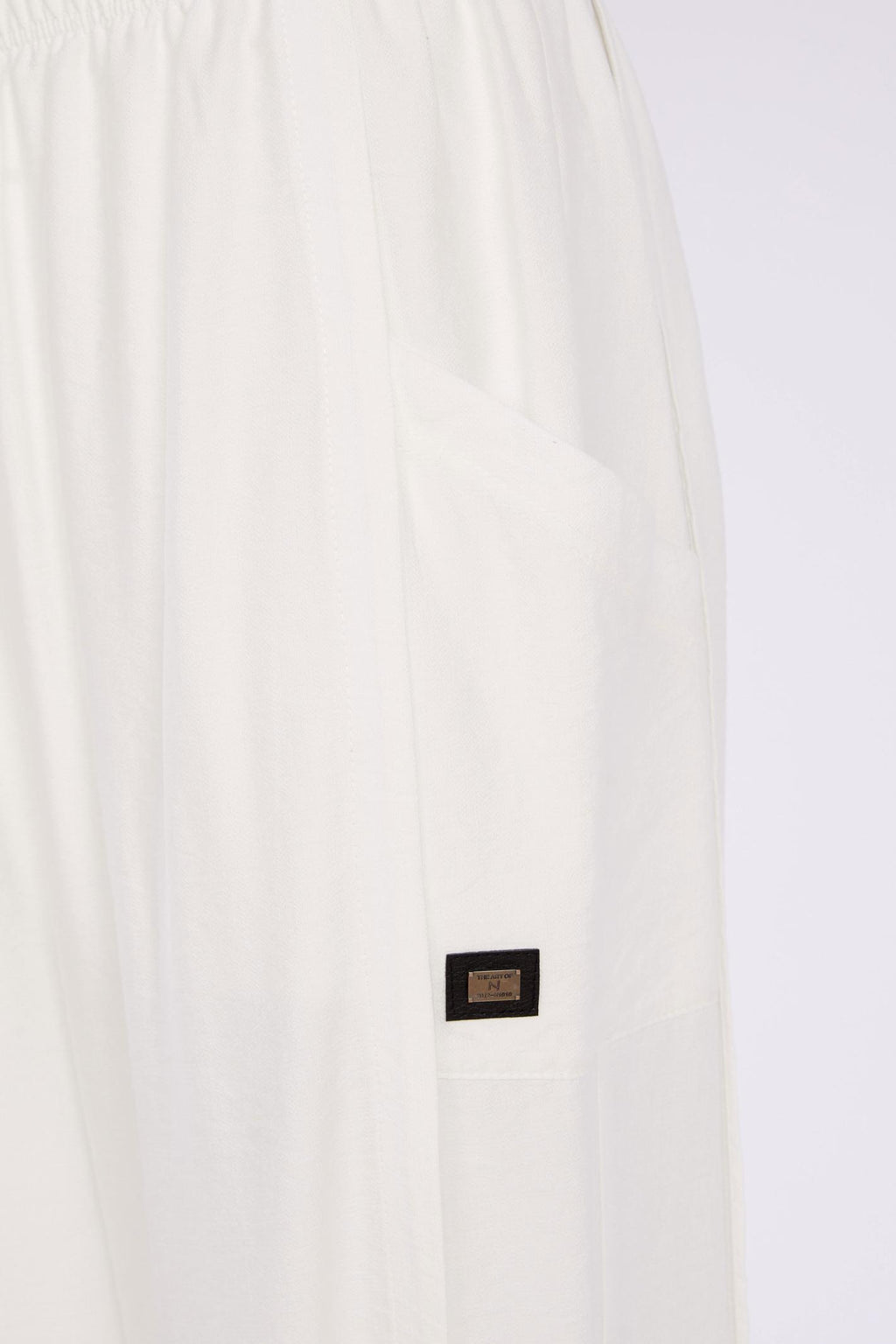 Close-up of Naya NAS26153 White Pull-On Trousers by Naya featuring side pocket detail, shop Naya at Dotique.