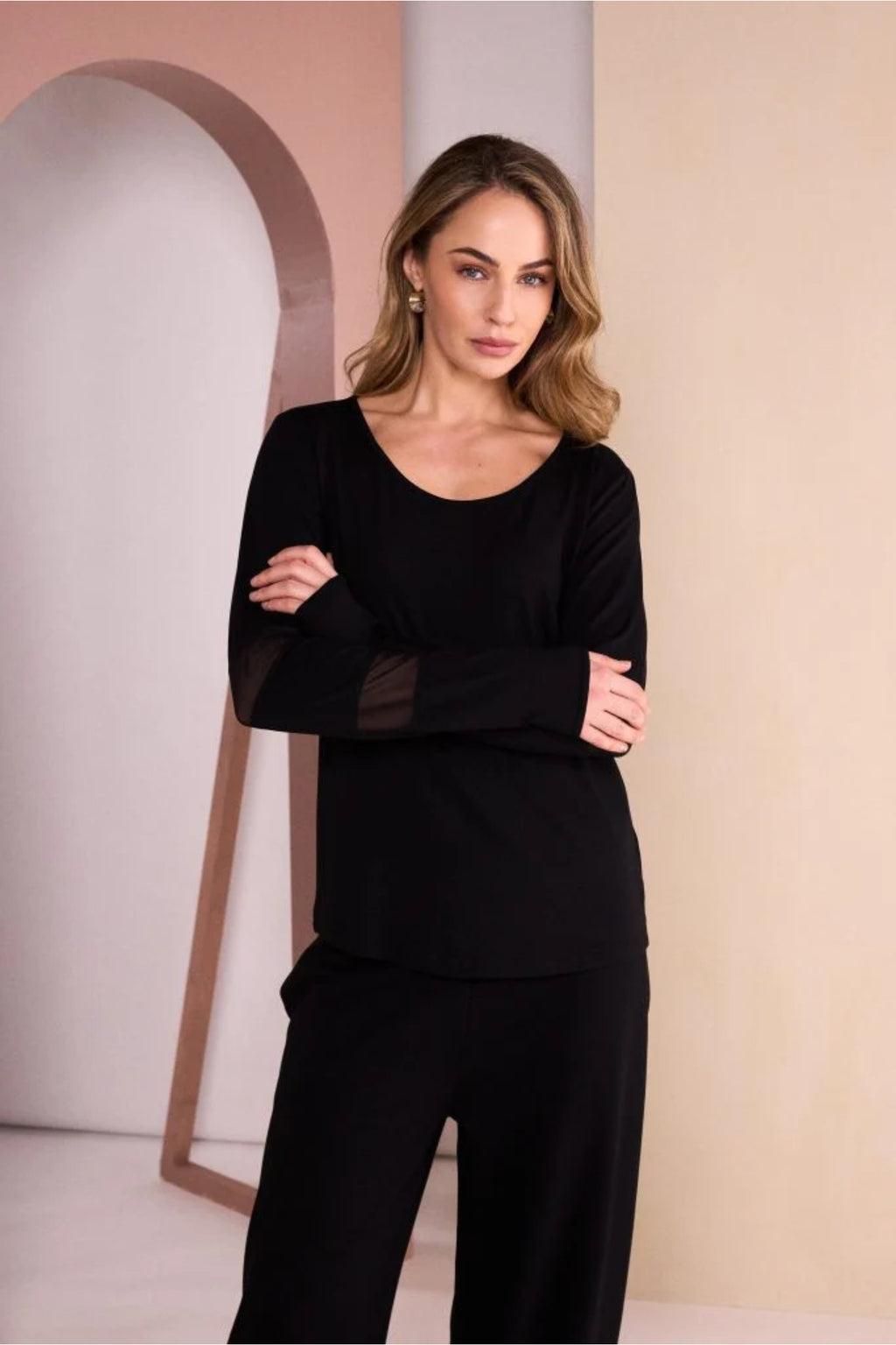 Shop the NAYA Black Mesh Insert Sleeve Jersey Top NAW26139 at Dotique. Stretch jersey with a scoop neckline and sheer mesh sleeve detailing.