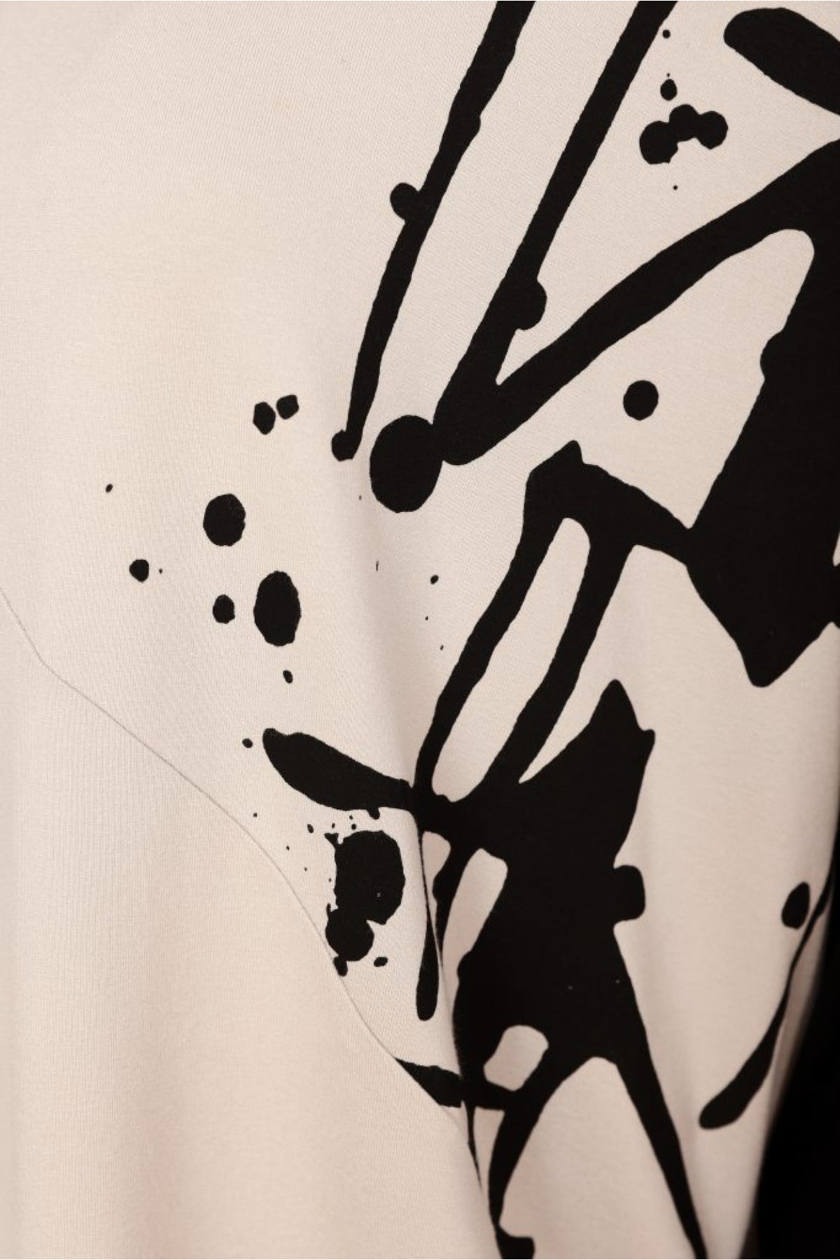 Naya NAW26140 Placement Print Top with Front Angle Seam Sand and Black abstract black print detail Shop Naya at Dotique